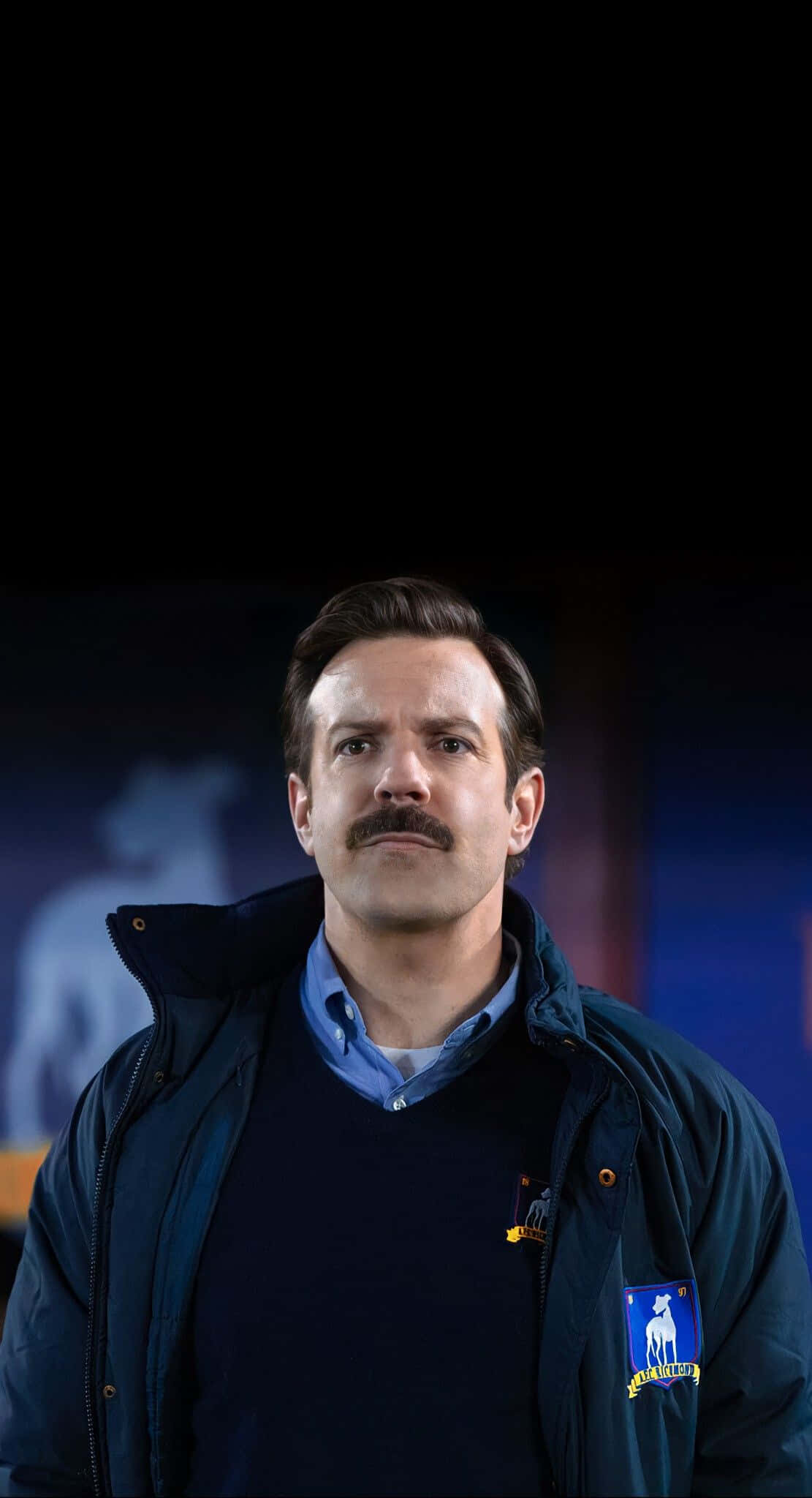 Ted Lasso, stadium background, dark blue jacket, Full HD Phone Wallpaper