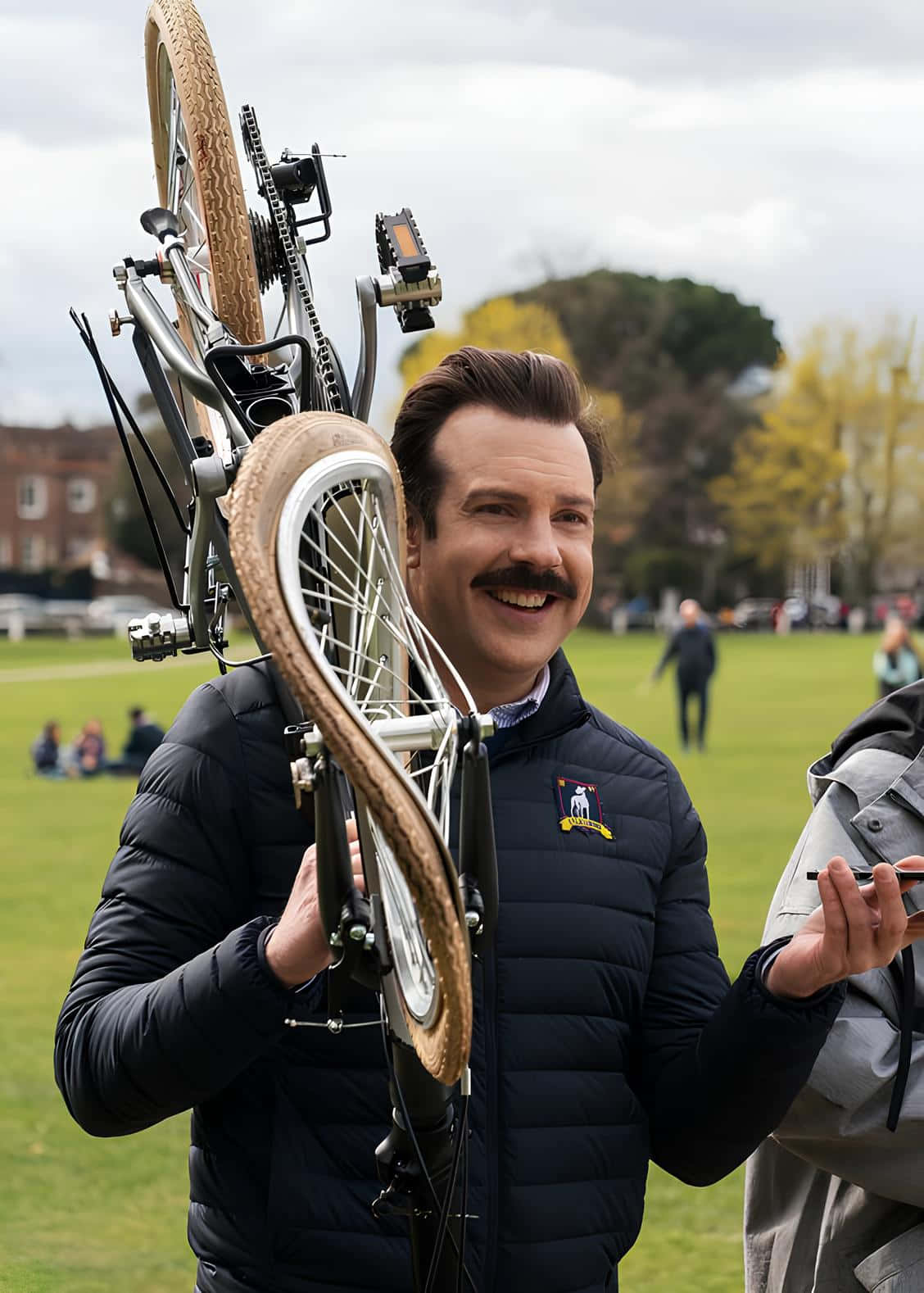 Ted Lasso, bicycle, grassy park, HD Phone Wallpaper