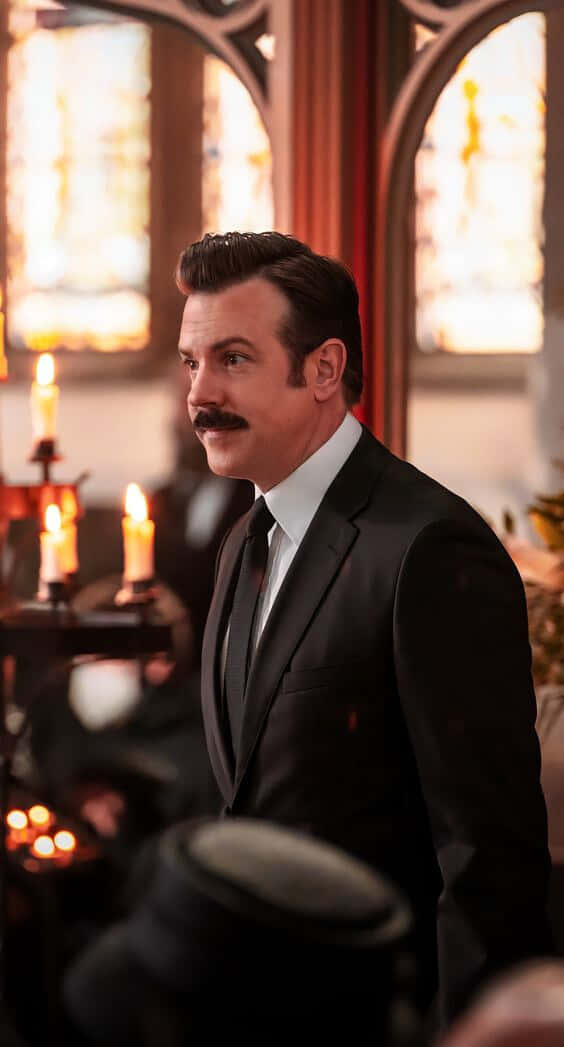Ted Lasso, black suit, candlelit church, SD Phone Wallpaper
