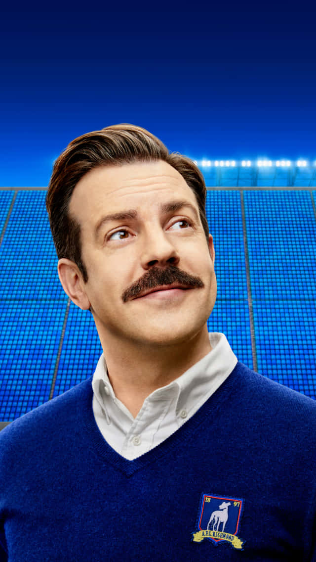 Ted Lasso, stadium backdrop, blue sweater, SD Phone Wallpaper