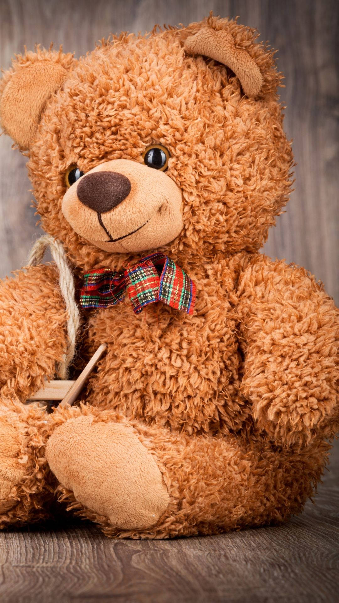 shaggy brown teddy bear, plaid bowtie, wooden surface, Full HD Phone Wallpaper