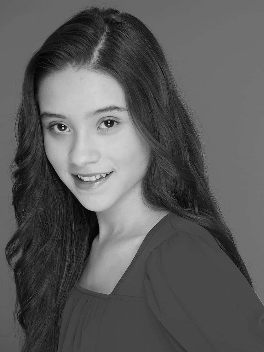 young teenage girl, black and white studio portrait, plain gray background, SD Phone Wallpaper
