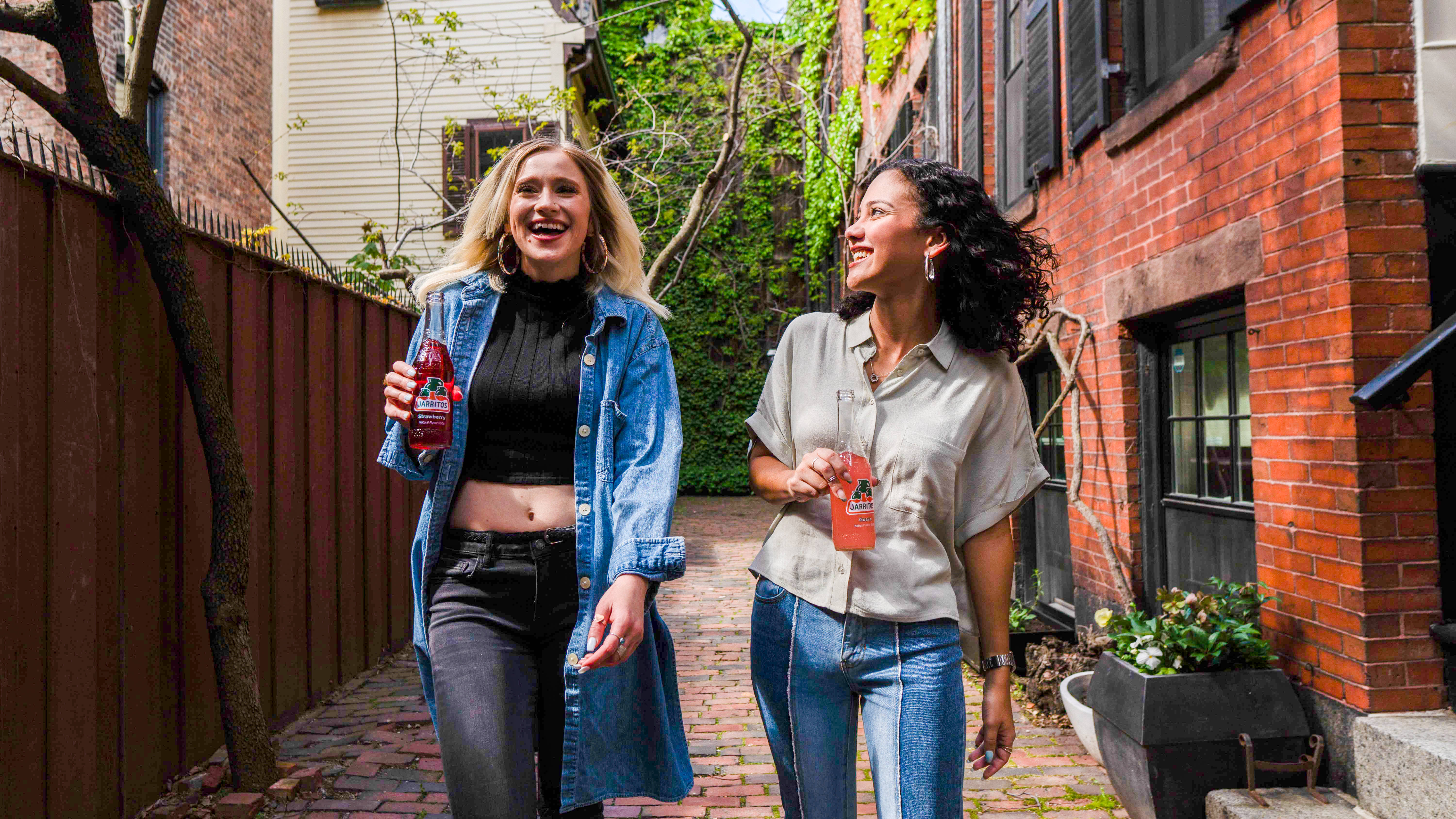 Teenage Girls, sunlit brick alleyway, greenery, 5K Desktop Wallpaper