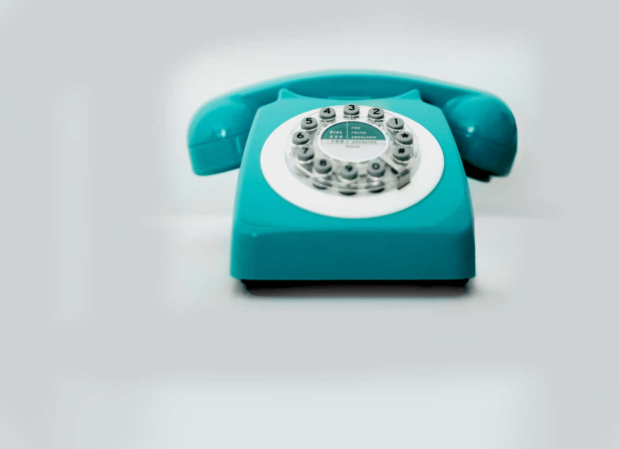 vintage turquoise rotary phone, white dial, soft gray background, SD Desktop Wallpaper
