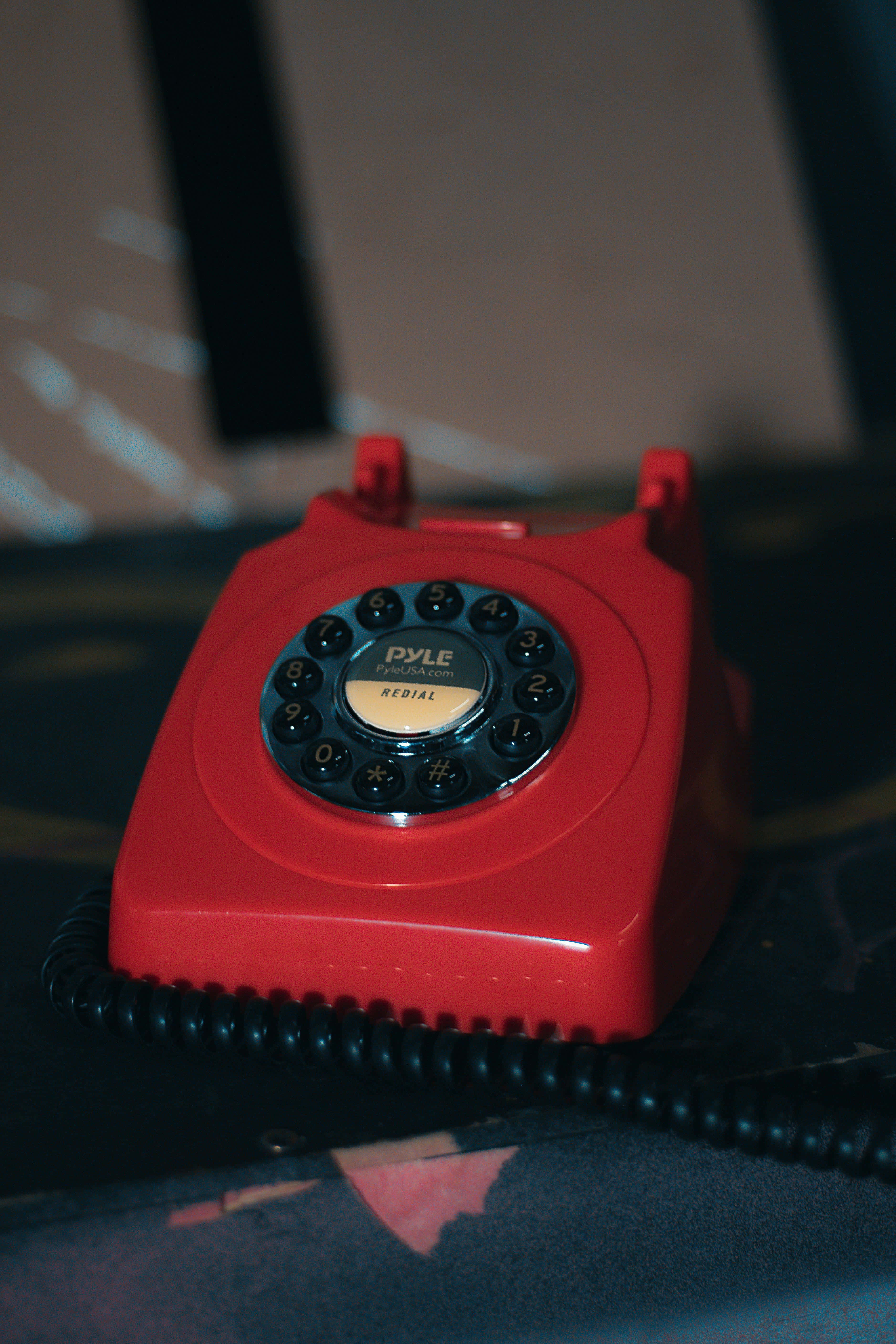 vintage red rotary phone, black dial, dark surface, 5K Phone Wallpaper