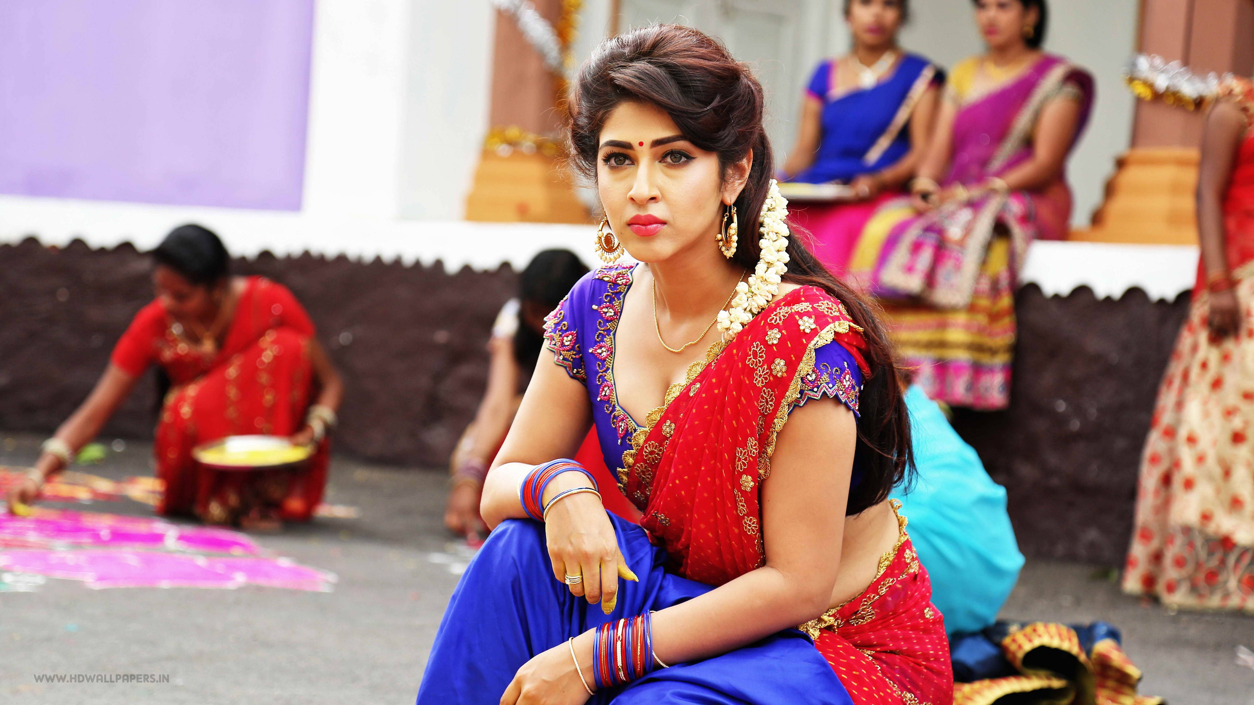 Telugu Heroines, vibrant red and blue traditional attire, rangoli patterns, 5K Desktop Wallpaper