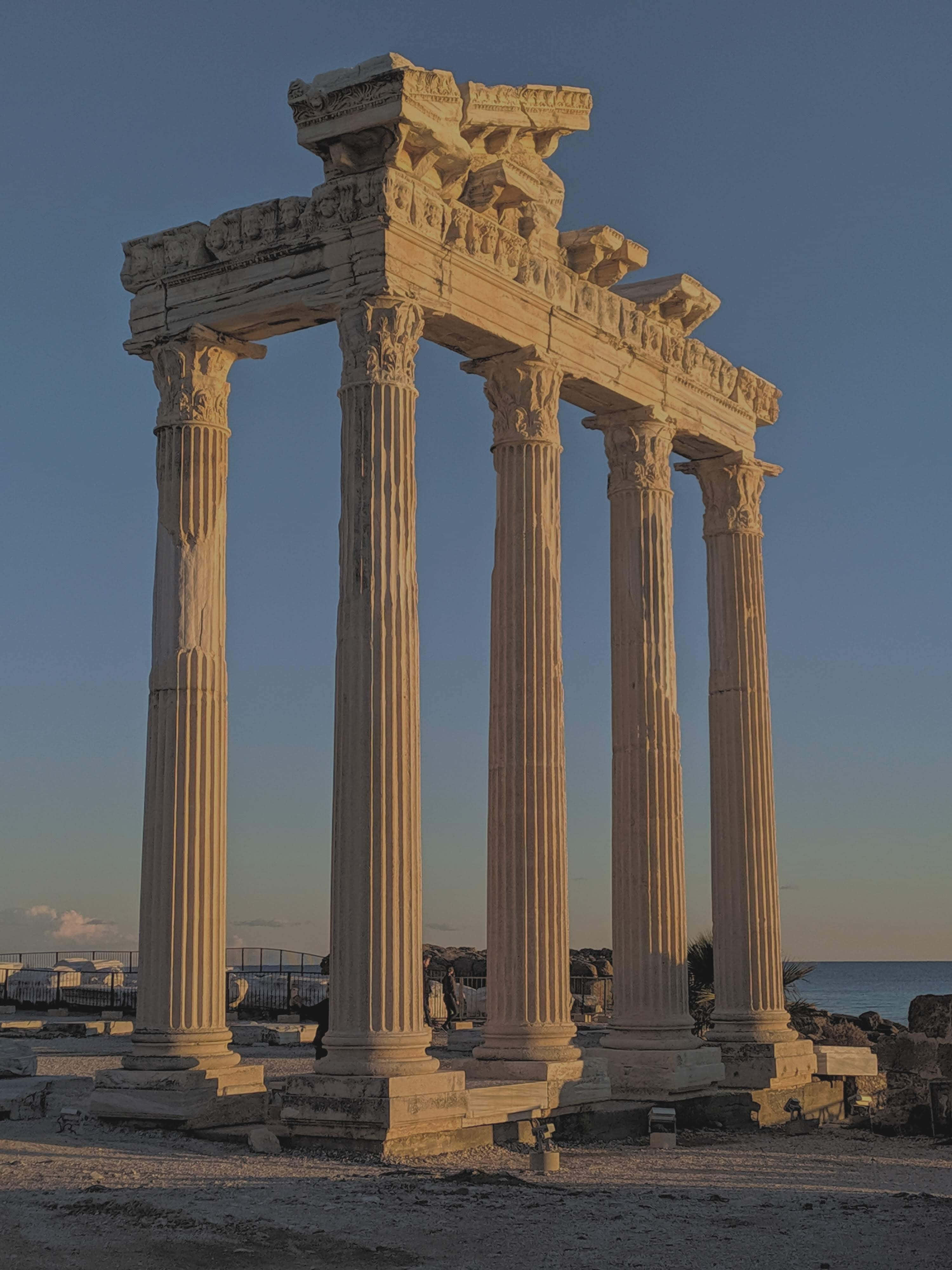 Temple Of Apollo, ancient stone temple columns, clear blue sky, 4K Phone Wallpaper