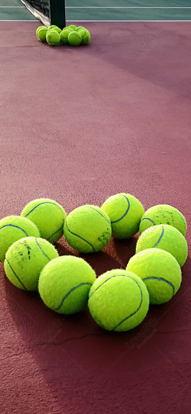 lime-green tennis balls, heart shape, textured red clay court surface, HD Phone Wallpaper
