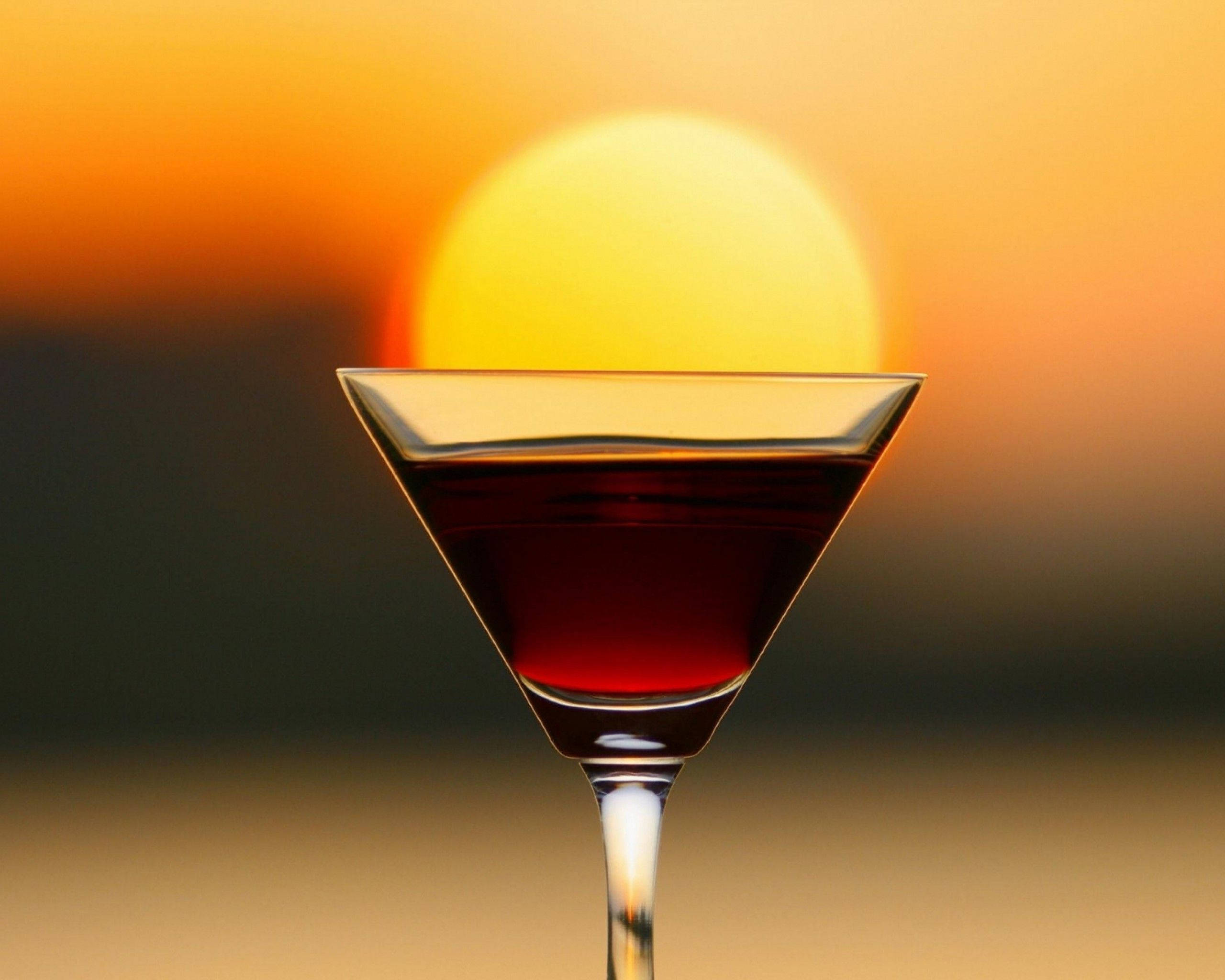 martini glass, red liquid, glowing sunset sun, 2K Desktop Wallpaper
