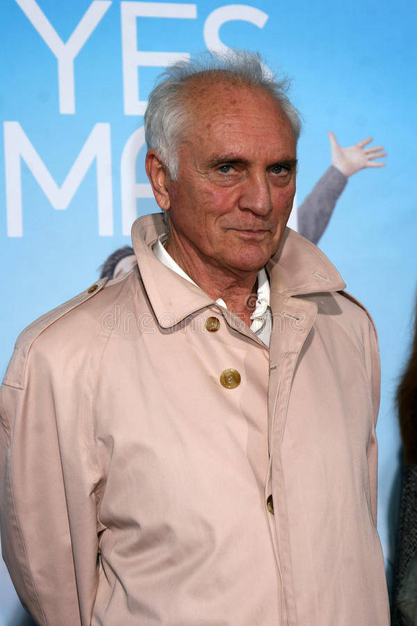 Terence Stamp, beige trench coat, blue backdrop, SD Phone Wallpaper