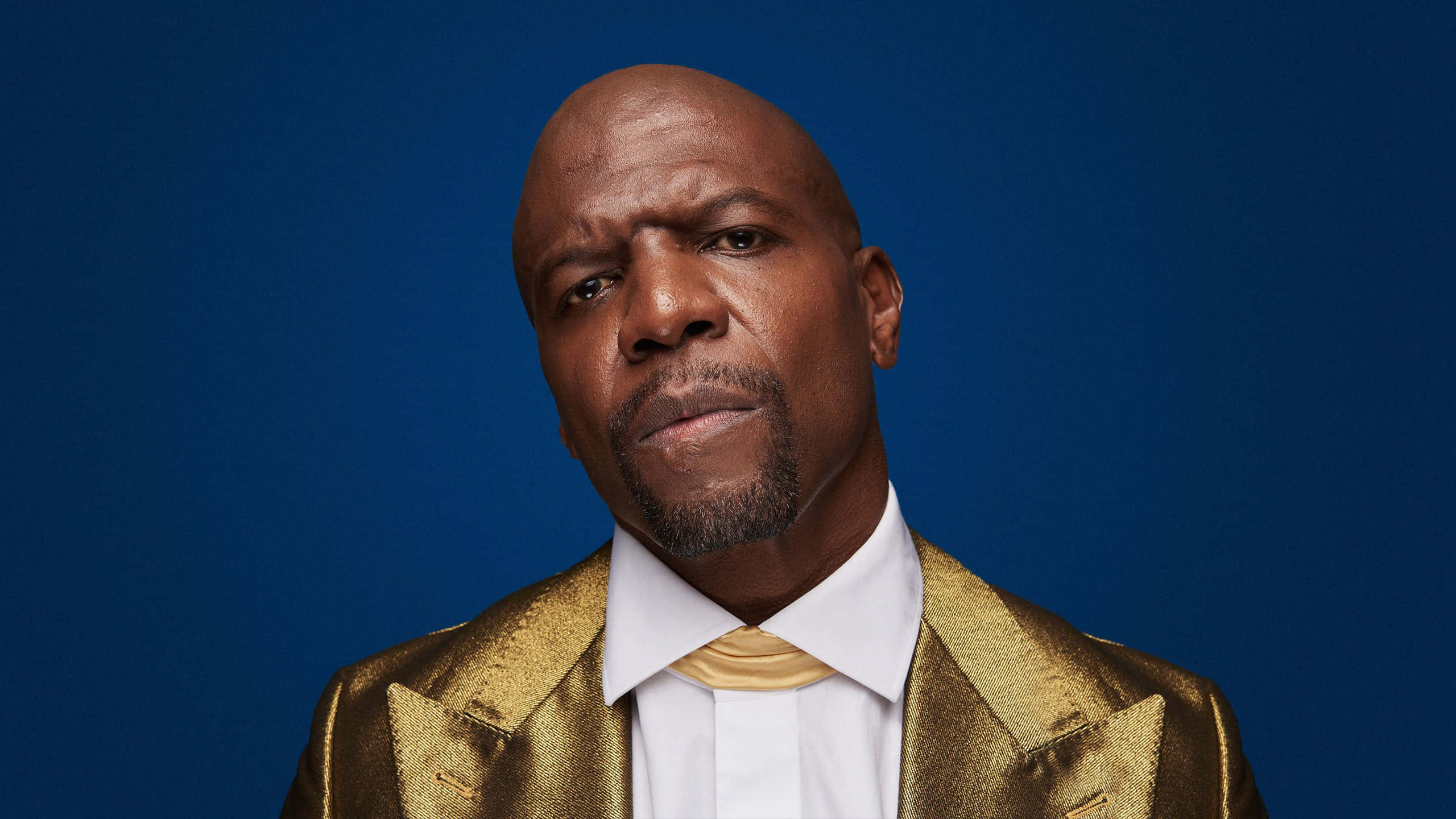 Terry Crews, shimmering gold suit, deep blue studio background, 2K Desktop Wallpaper