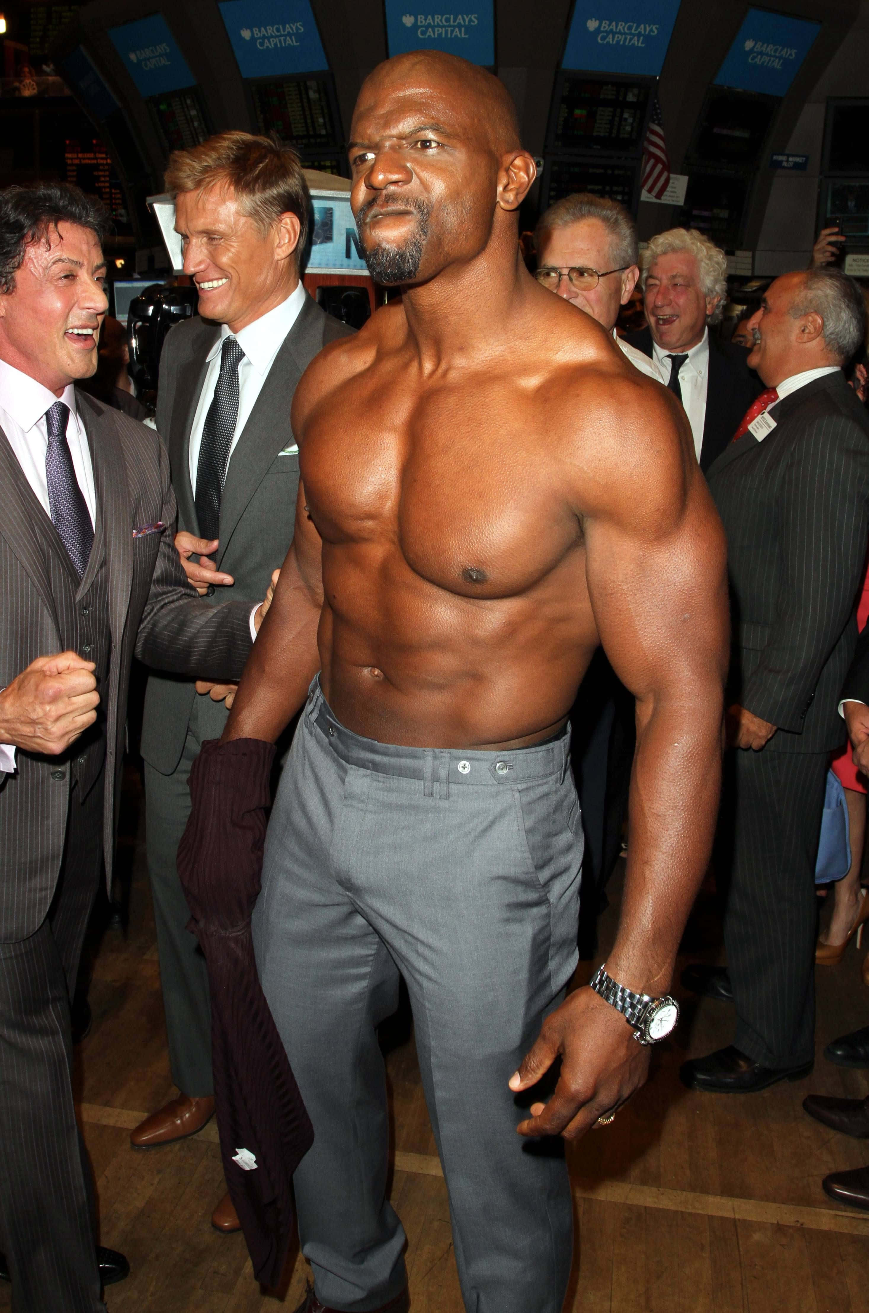 Terry Crews, grey trousers, bustling financial trading floor, 4K Phone Wallpaper