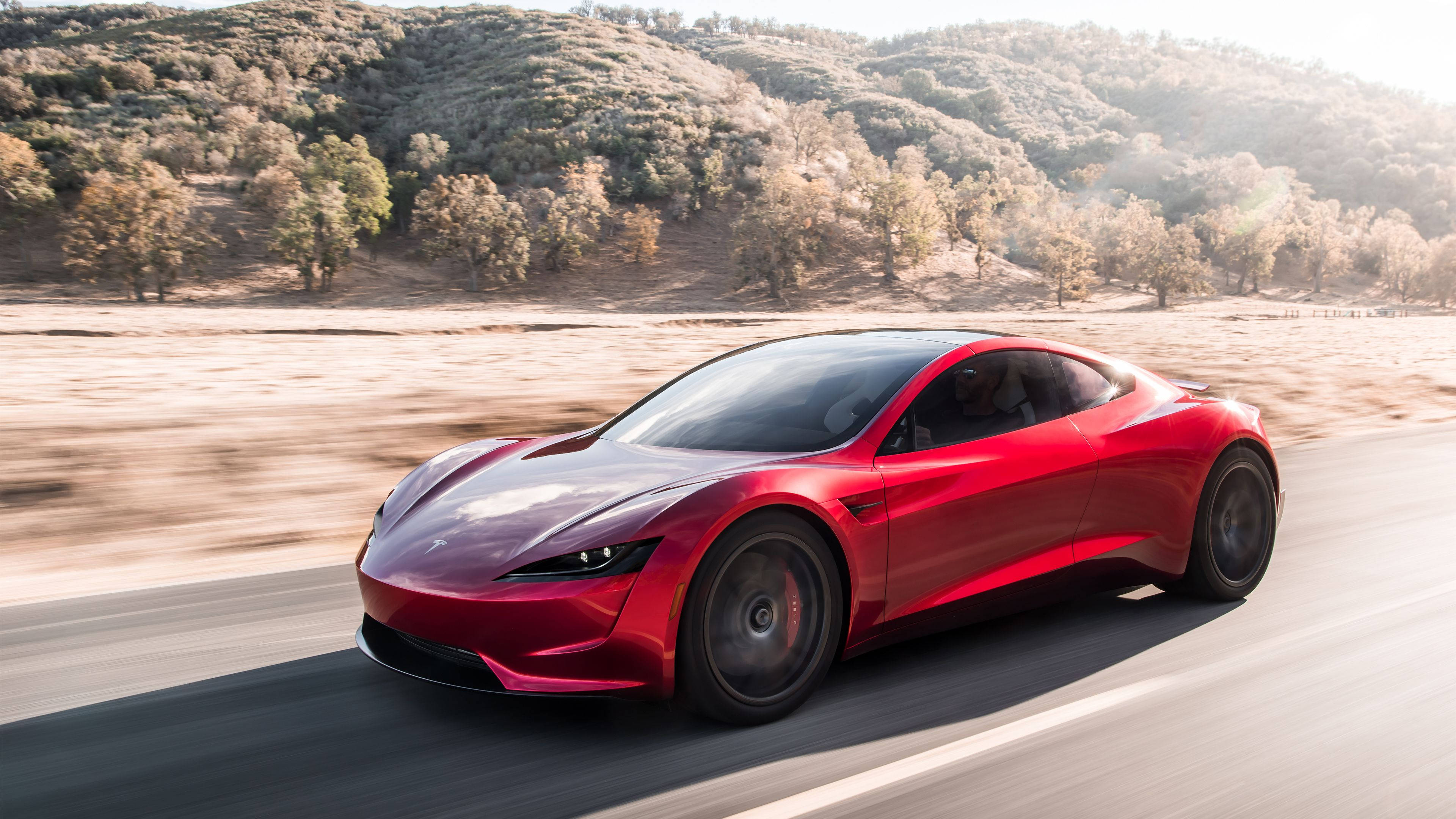Tesla Roadster, red, sunlit road, 4K Desktop Wallpaper