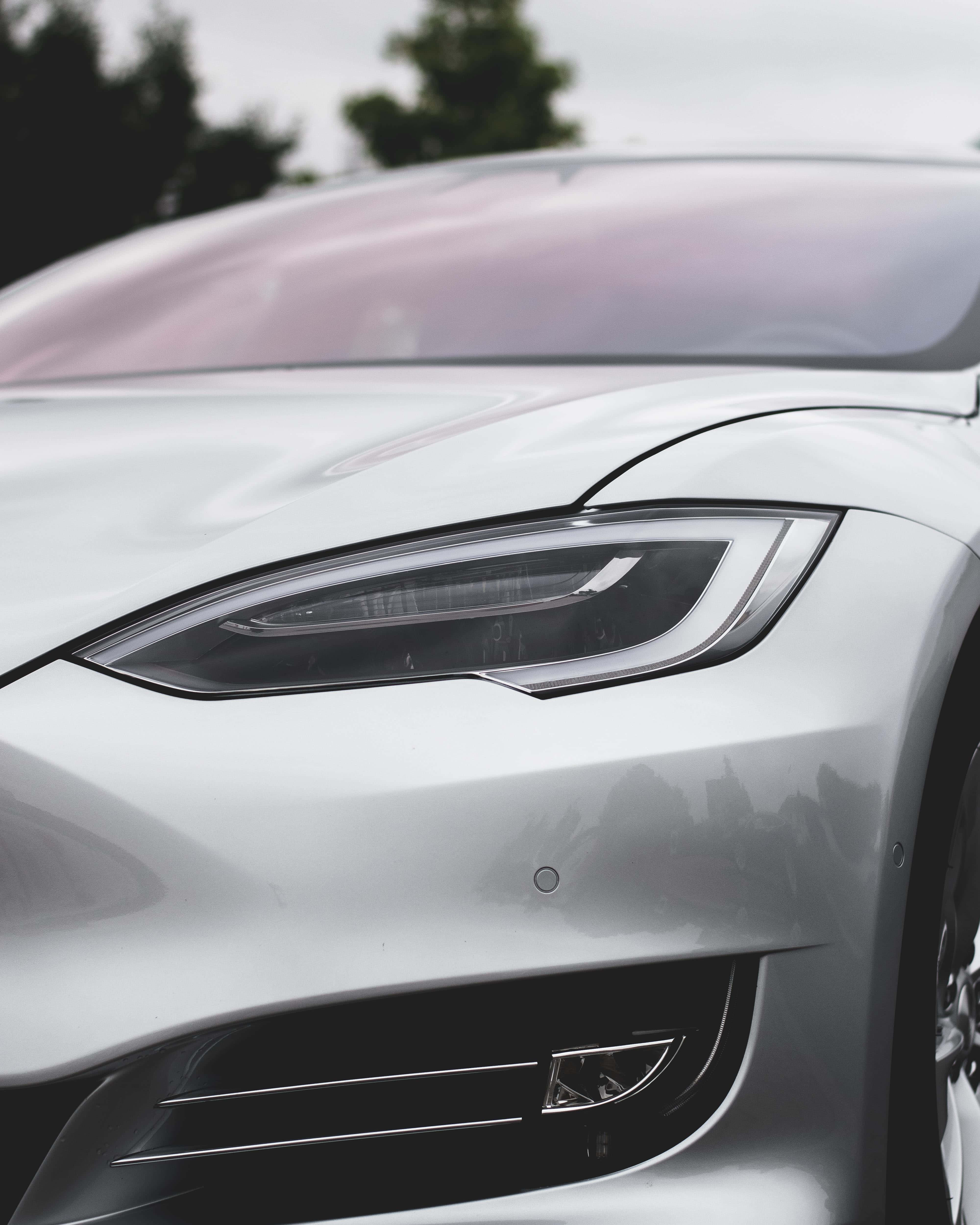 Tesla Roadster, sleek silver, sharp headlights, 4K Phone Wallpaper