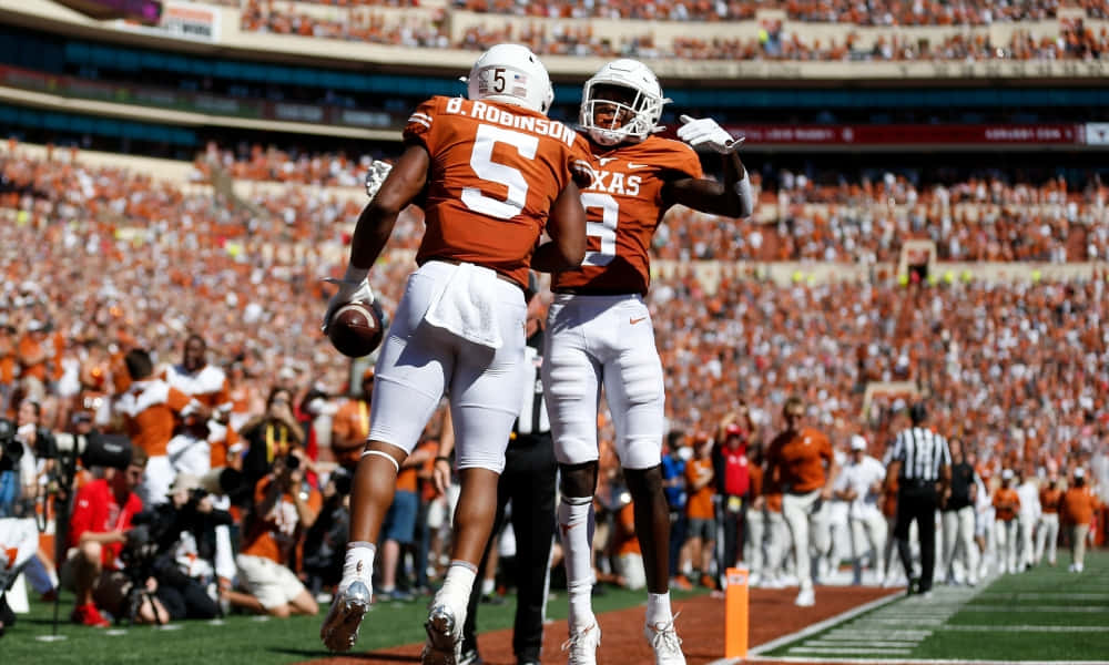 Texas Football, orange jerseys, sunlit field, SD Desktop Wallpaper