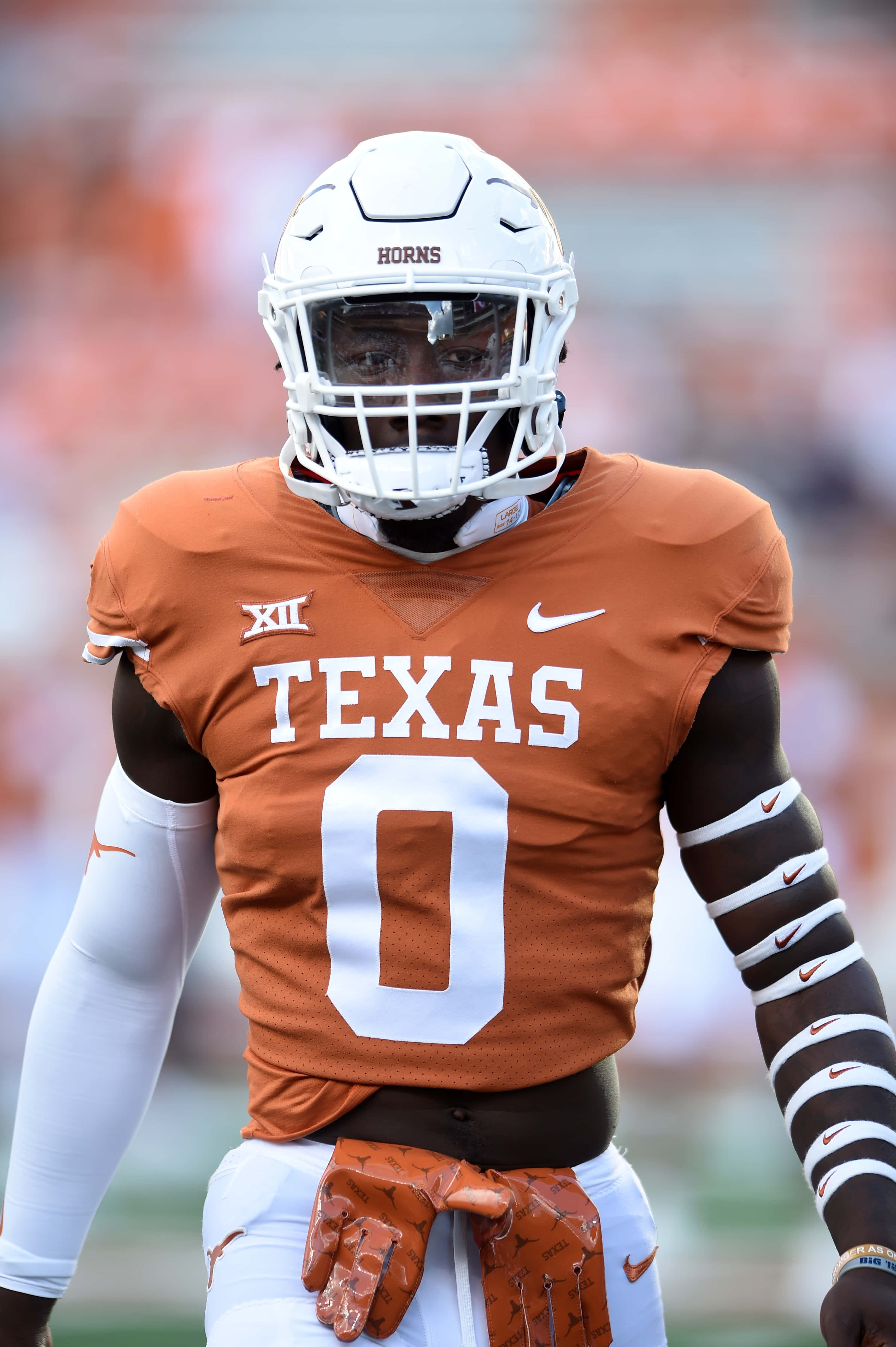 Texas Football, number zero, orange and white uniform, 4K Phone Wallpaper