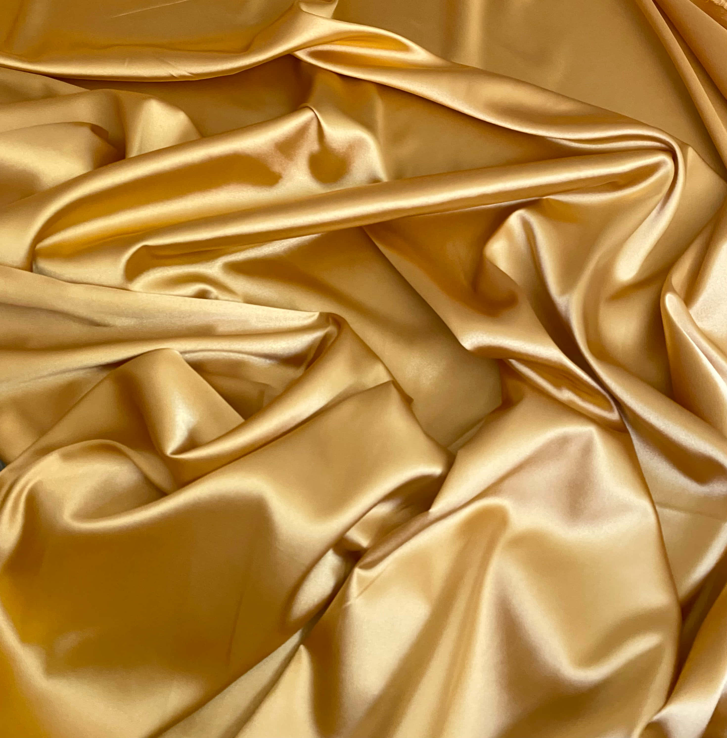 gold satin fabric, glossy folds, soft light, 2K Phone Wallpaper