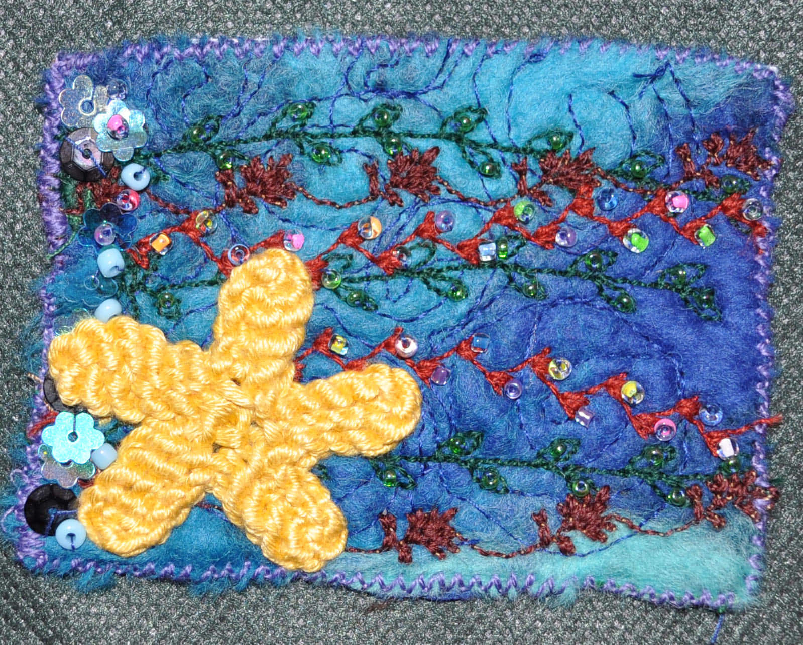 yellow crocheted starfish, blue textured fabric, red green thread vines, HD Desktop Wallpaper