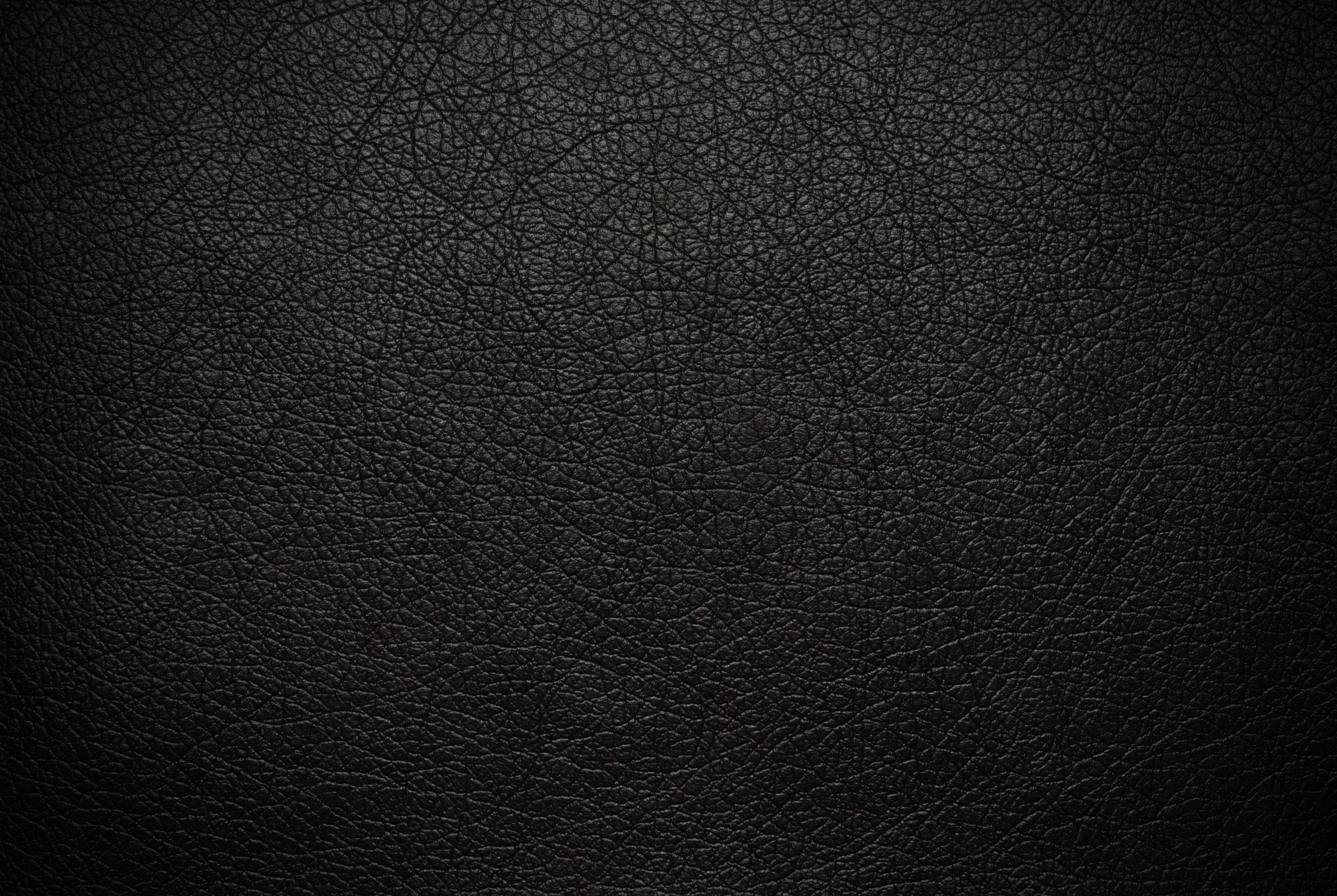 fine black leather, dark textured black leather surface, subtle grain patterns, 4K Desktop Wallpaper