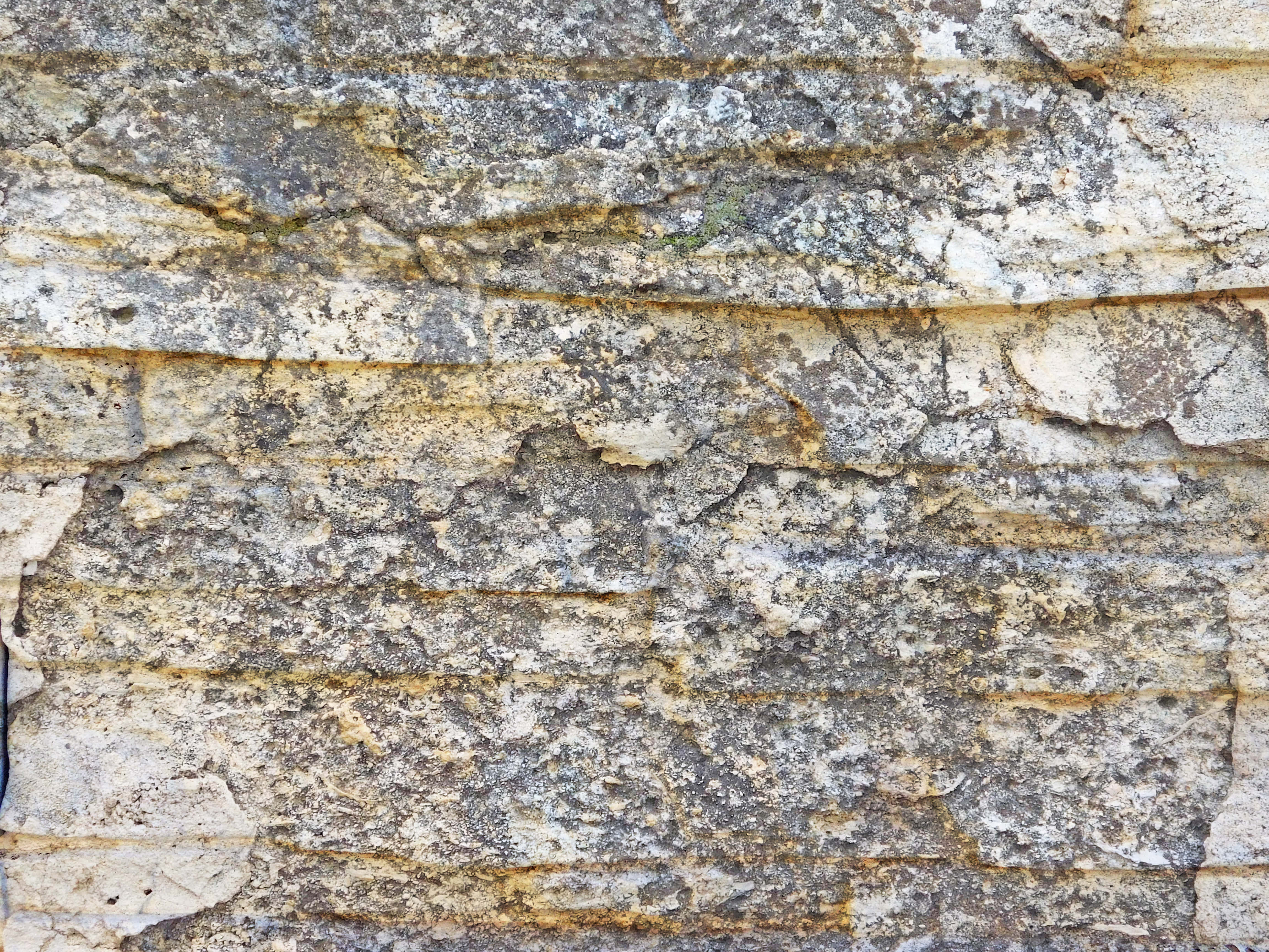 stone wall, layered horizontal cracks, patches of lichen, 4K Desktop Wallpaper