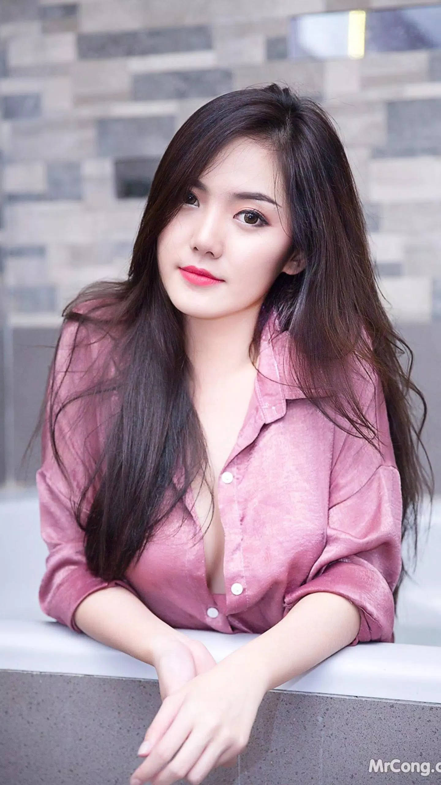 pink button-up shirt, long dark hair, modern stone ledge, 2K Phone Wallpaper
