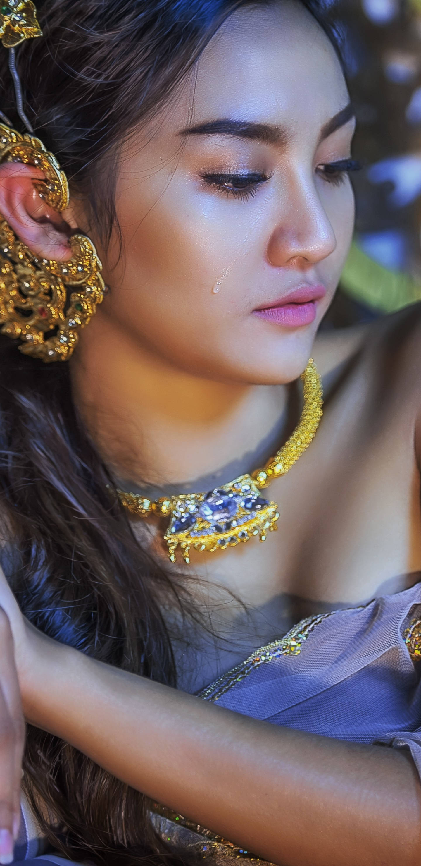 Thailand Woman, ornate gold jewelry, tear falling from her eye, 2K Phone Wallpaper