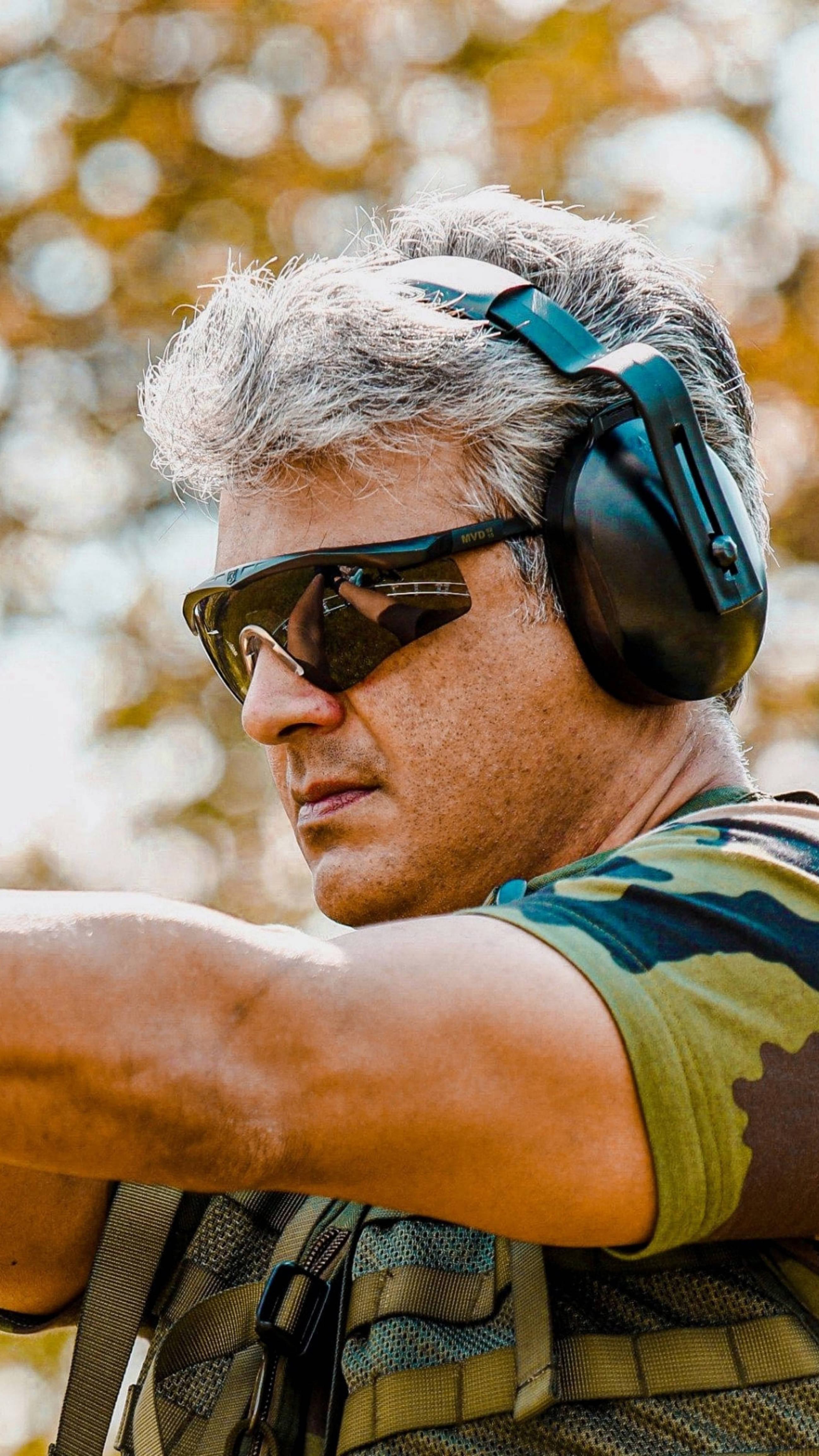 Thala Ajith, rifle shooting competition, ear protection, 4K Phone Wallpaper