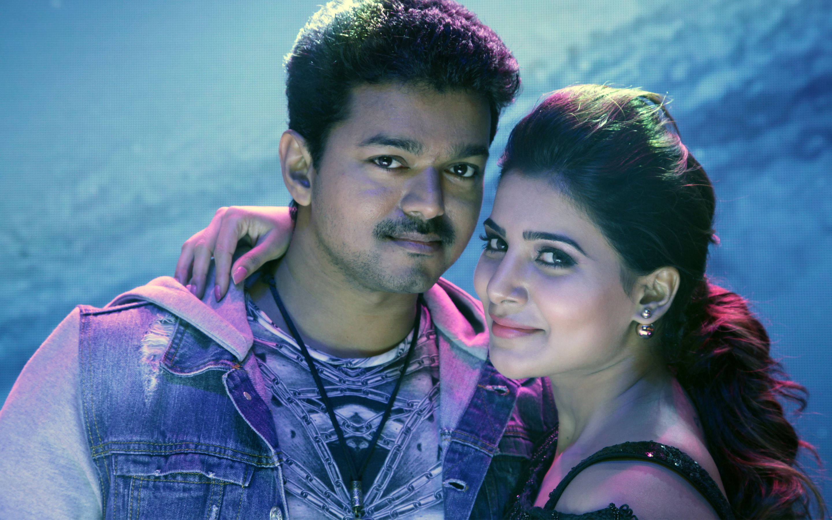 Thalapathy Vijay, female co-star, vibrant blue and purple stage lighting, 2K Desktop Wallpaper