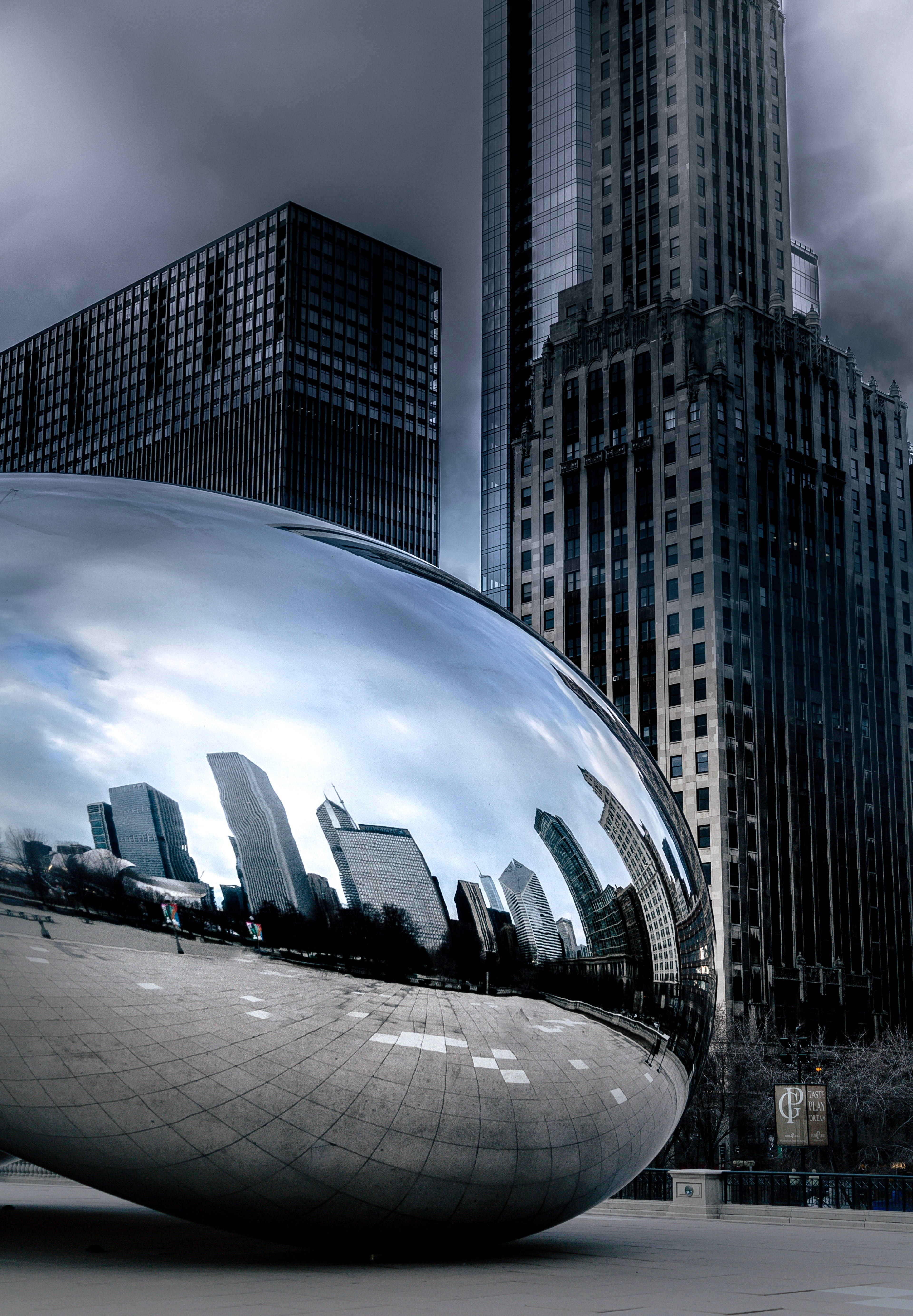 The Bean Chicago, reflecting buildings, moody gray sky, 5K Phone Wallpaper