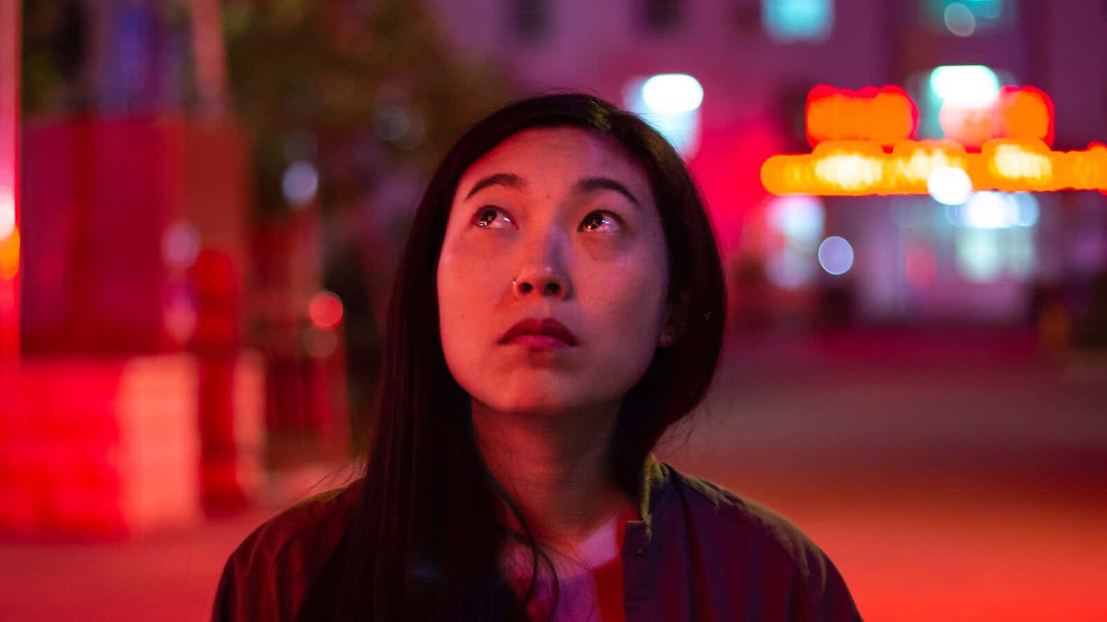 The Farewell, neon-drenched urban night scene, blurred red and orange lights, HD Desktop Wallpaper