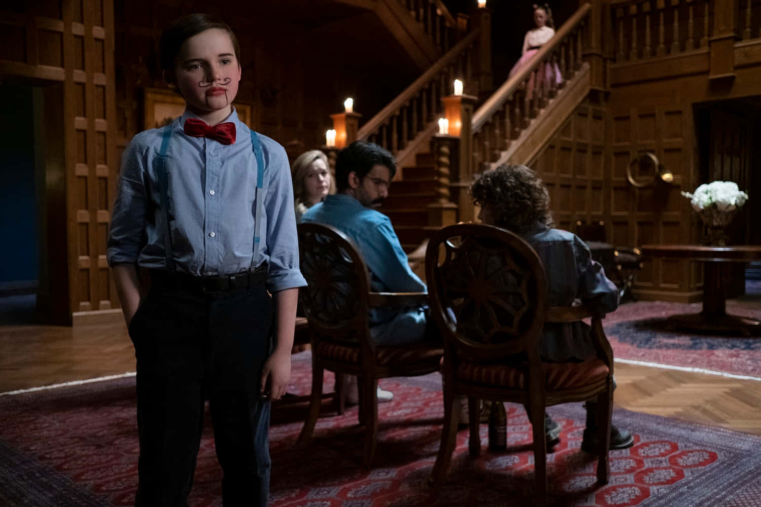 The Haunting of Bly Manor, young boy with a mustache and red bowtie, dimly lit wooden mansion hall, HD Desktop Wallpaper