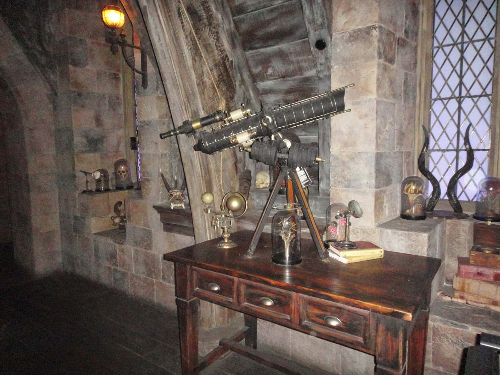 The Hogwarts Dark Arts Classroom, stone-walled room, wooden desk, HD Desktop Wallpaper