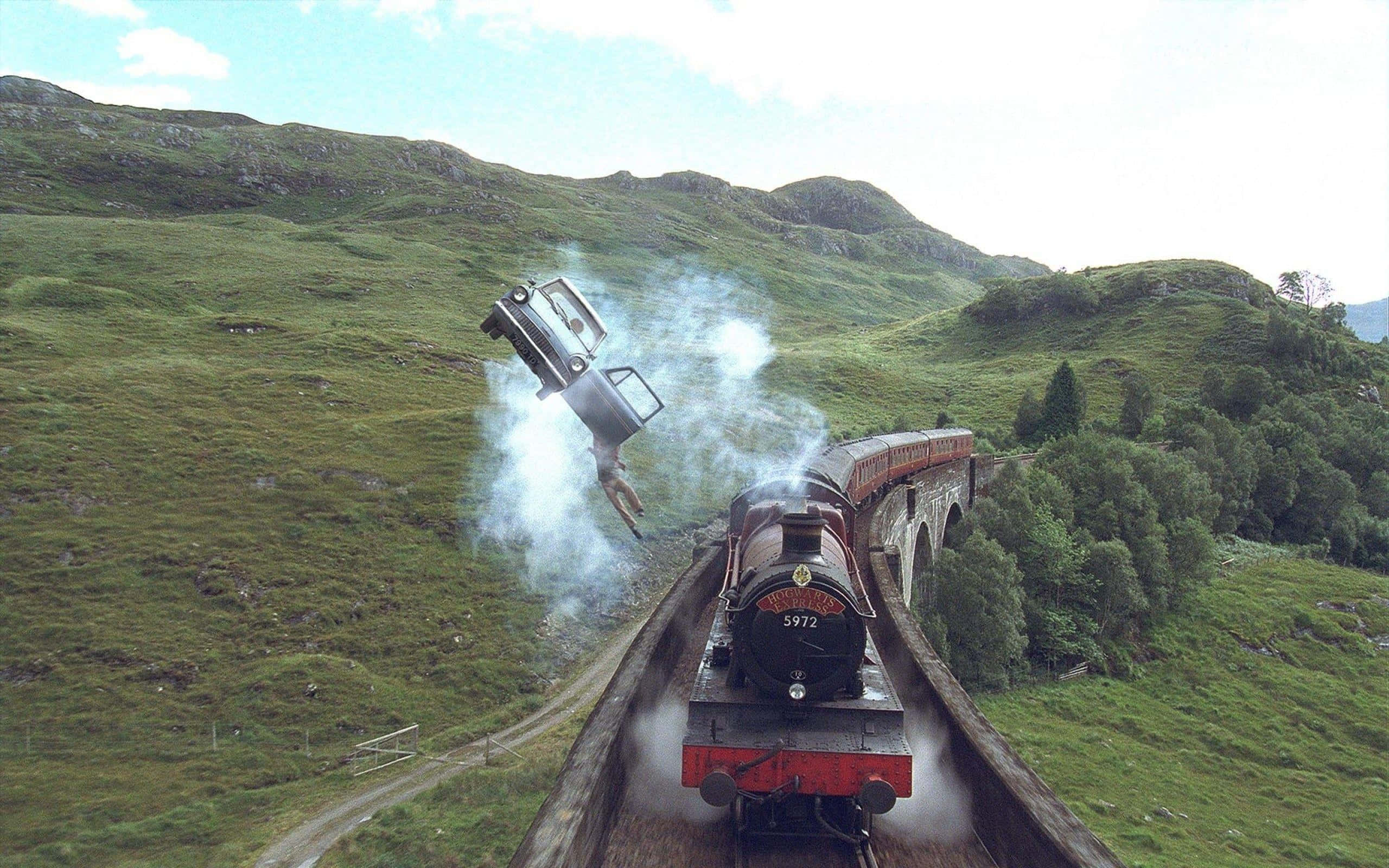 The Hogwarts Express Train, stone viaduct, green hills, 2K Desktop Wallpaper