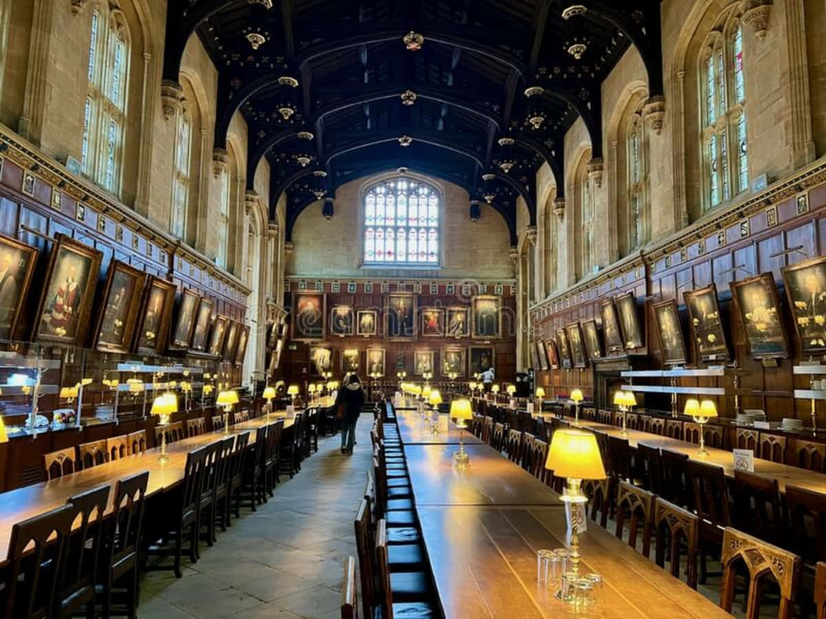 The Hogwarts Great Hall, long wooden tables, warm lamps, SD Desktop Wallpaper