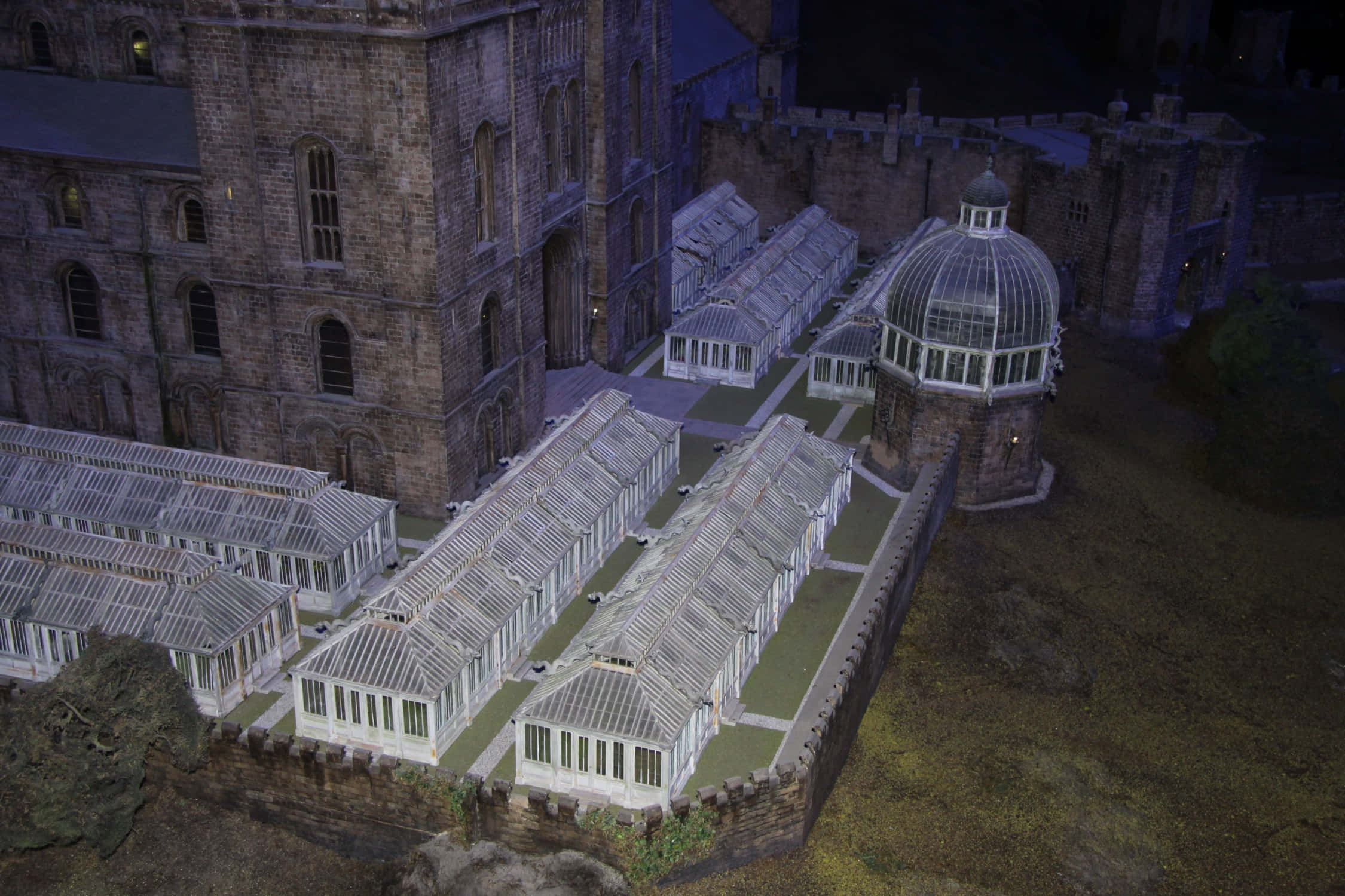 The Hogwarts Greenhouses, stone castle complex, illuminated glass conservatories, Full HD Desktop Wallpaper