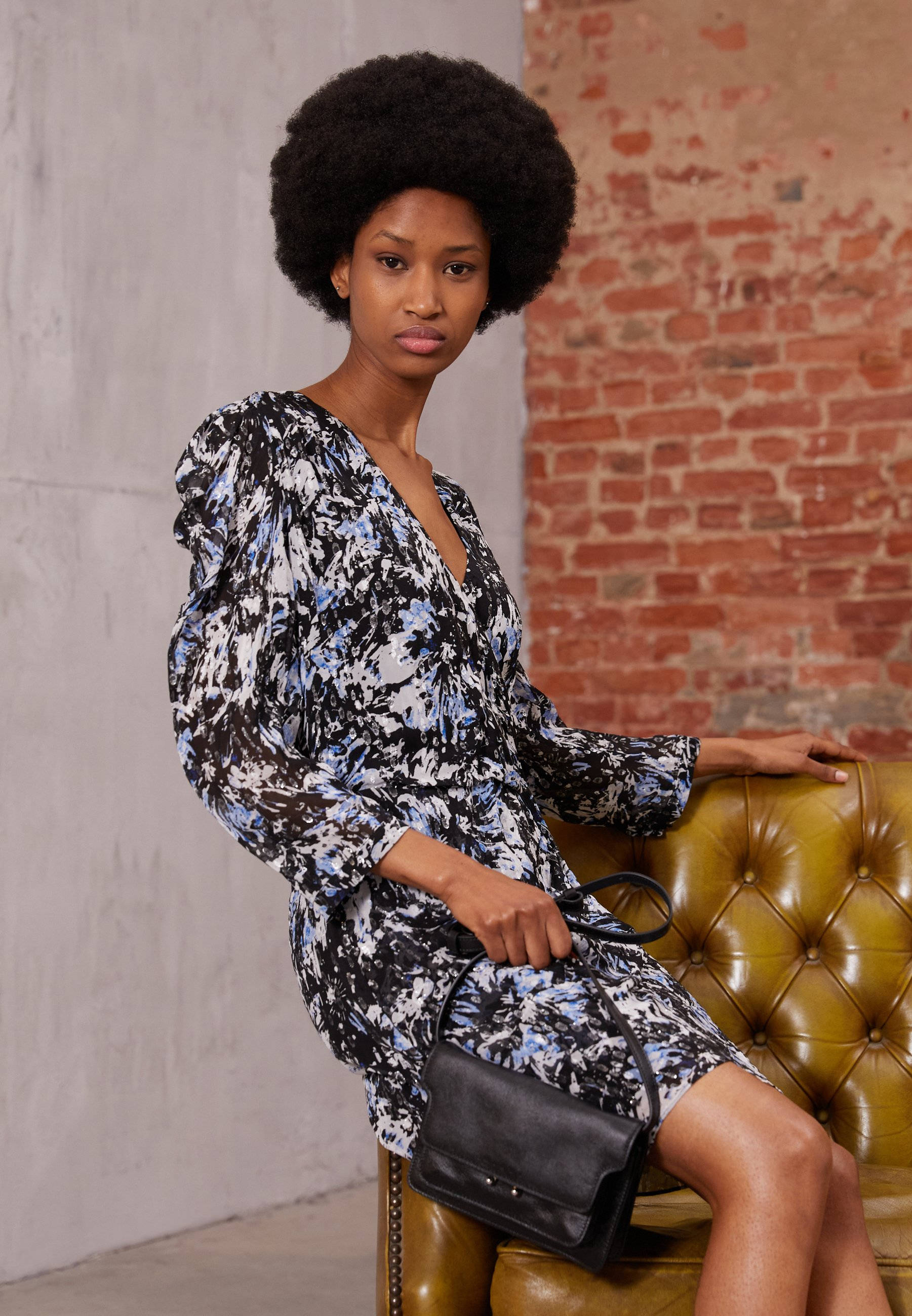 The Kooples, afro hair, vintage green tufted chair, 2K Phone Wallpaper