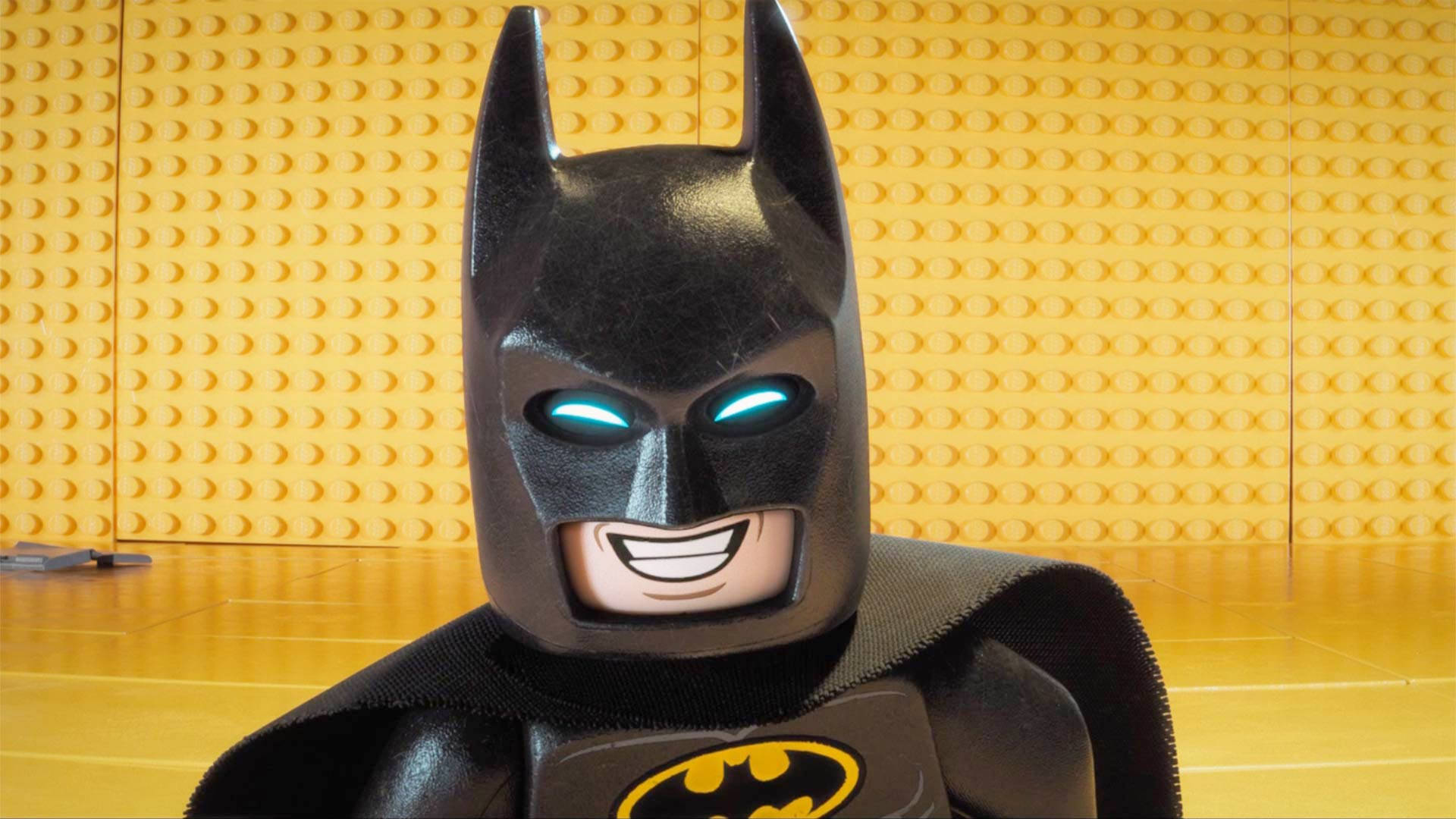 Lego Batman, glowing blue eyes, yellow brick wall, Full HD Desktop Wallpaper