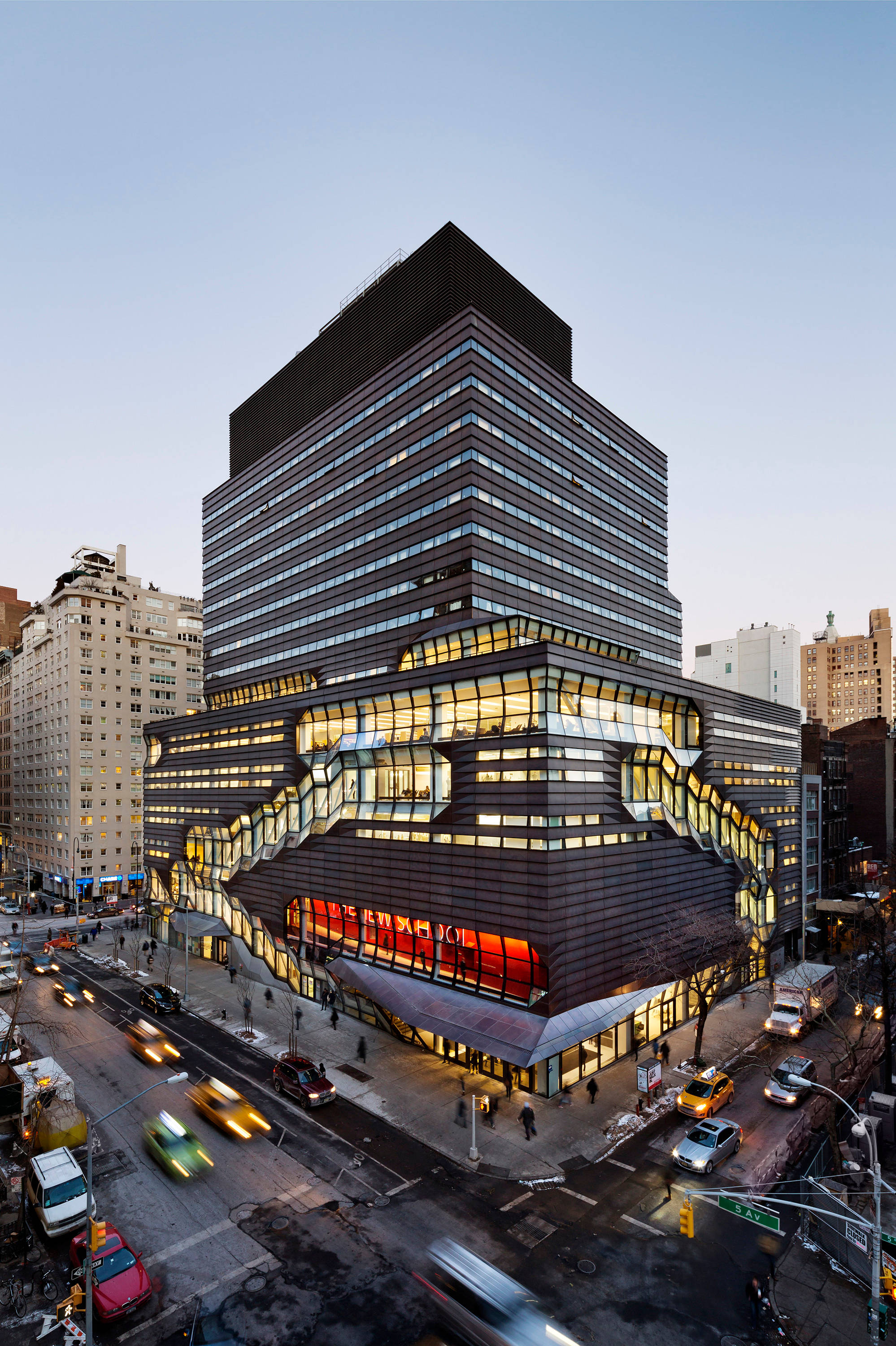 The New School, glowing windows, geometric facade, 2K Phone Wallpaper