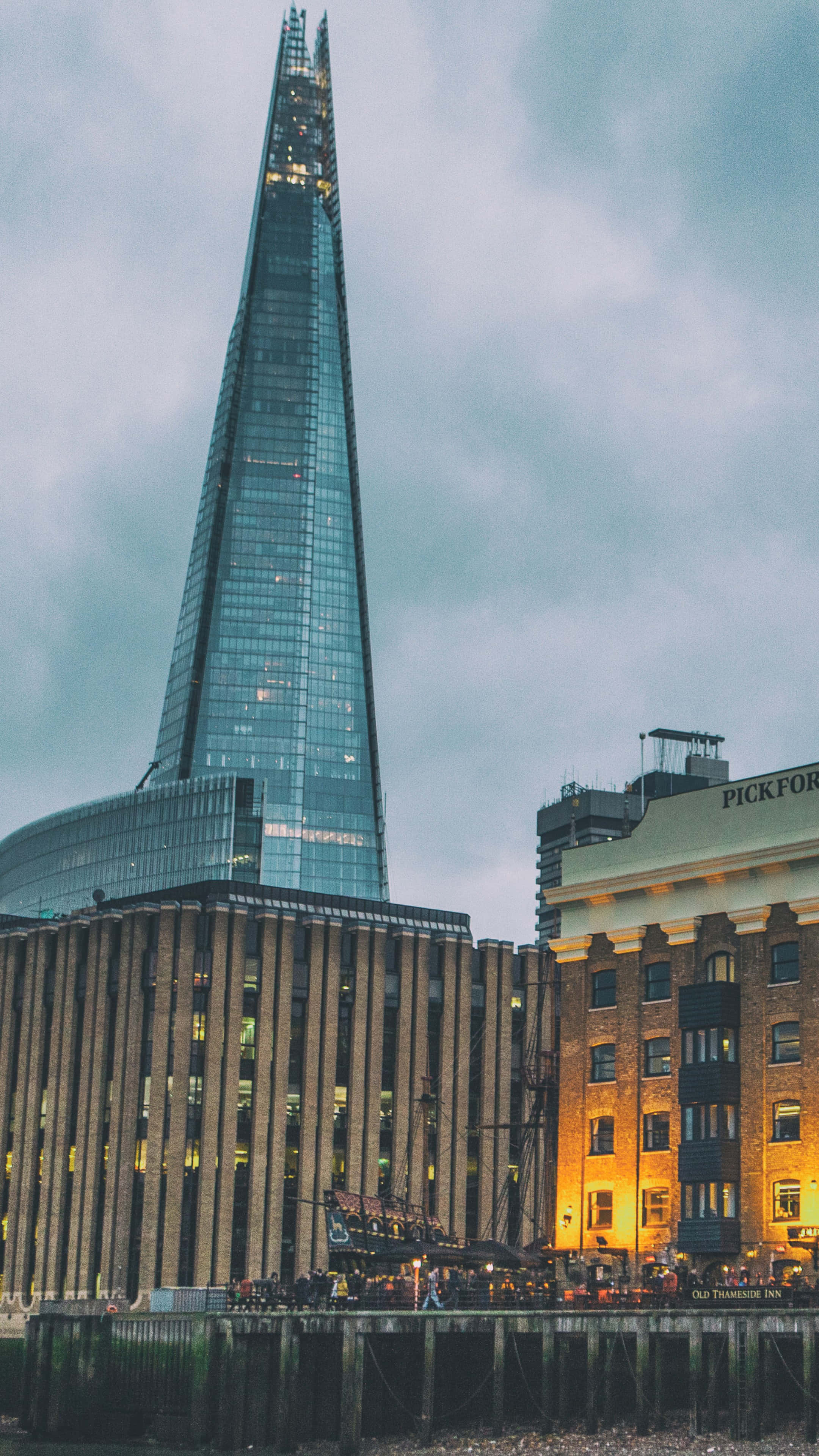 The Shard, historic brick buildings, moody overcast sky, 4K Phone Wallpaper