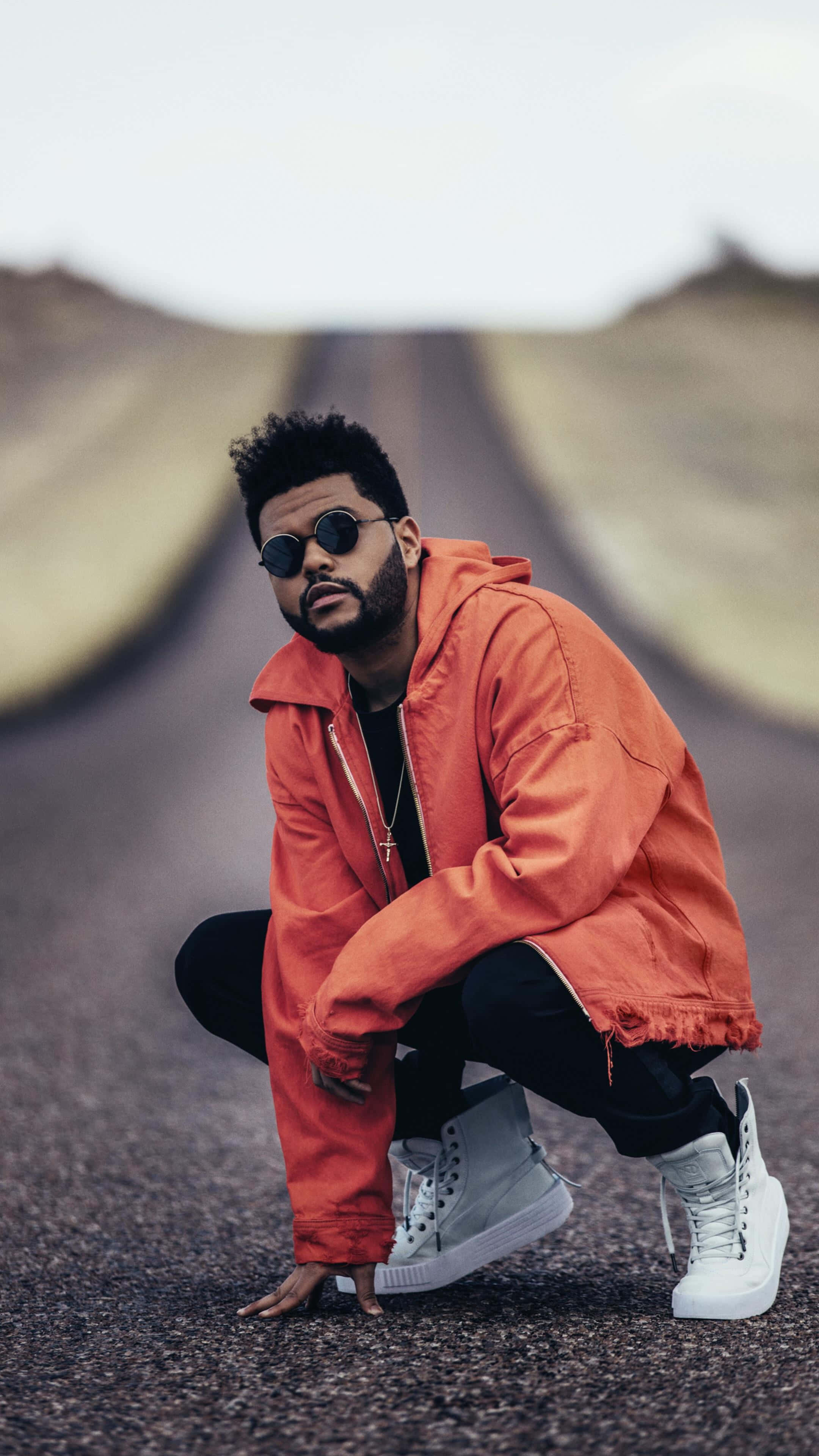 The Weeknd After Hours, bright orange jacket, empty asphalt road, 4K Phone Wallpaper