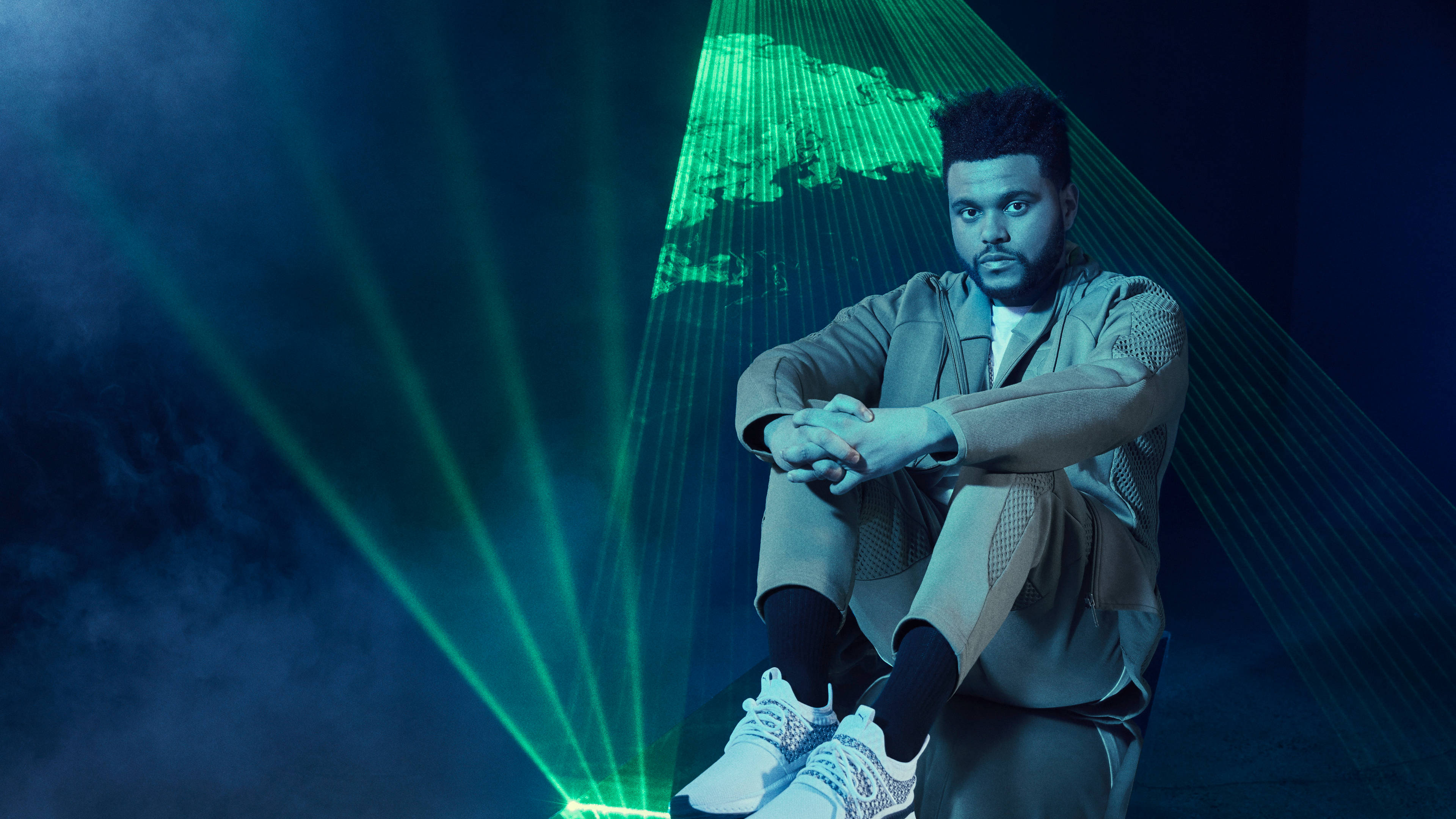 The Weeknd, vibrant green laser beams, dimly lit stage, 4K Desktop Wallpaper