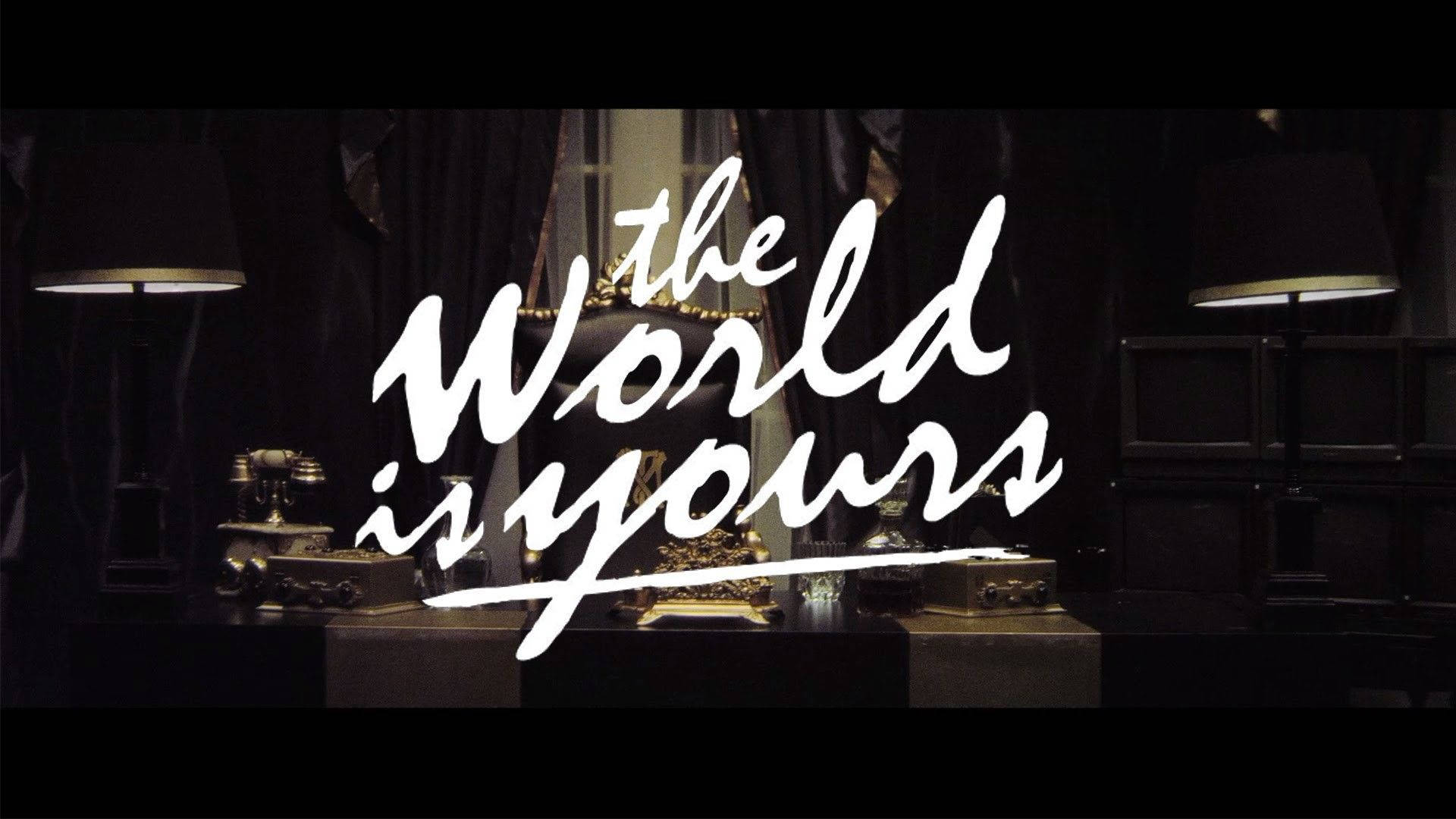 The World Is Yours, white cursive text, dimly lit vintage room, Full HD Desktop Wallpaper