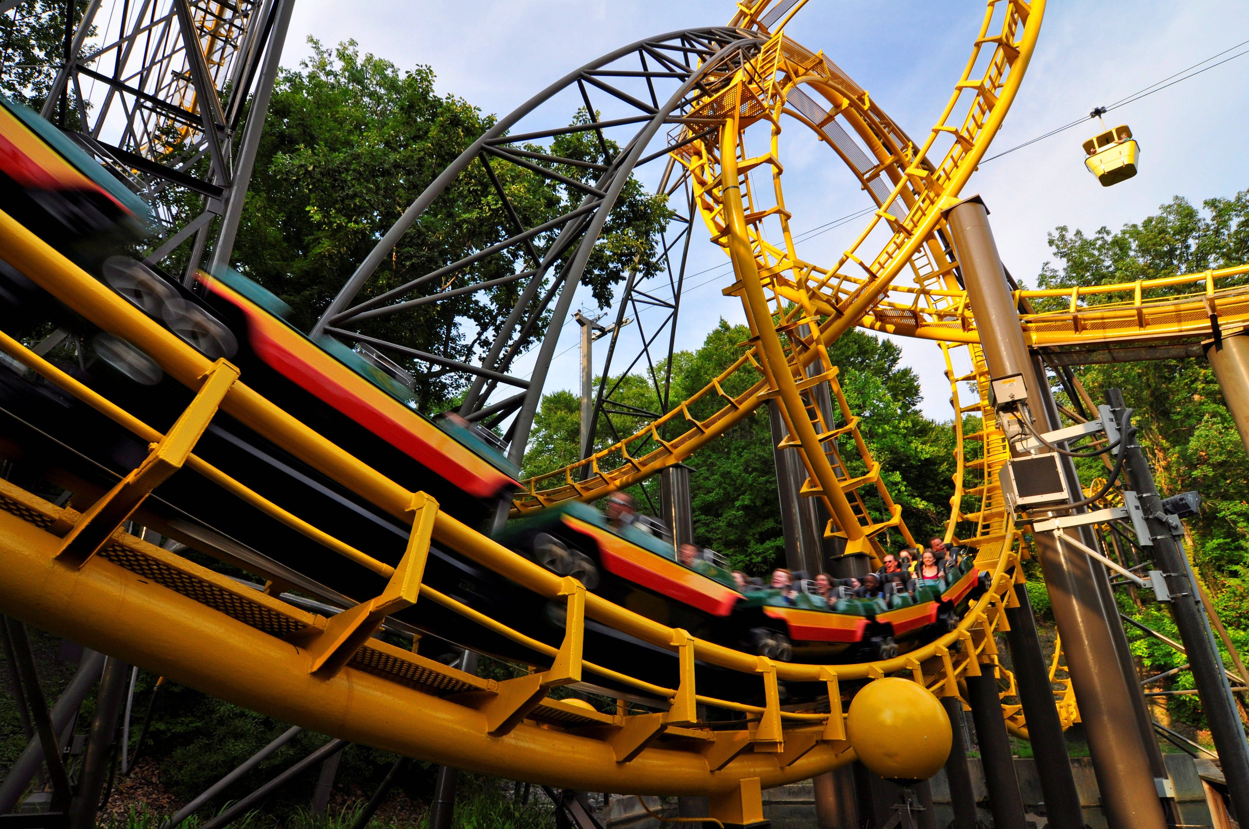 yellow roller coaster, lush green trees, bright blue sky, 4K Desktop Wallpaper