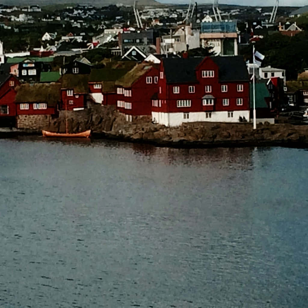 Thorshavn, red and white houses, rocky shore, SD Desktop Wallpaper