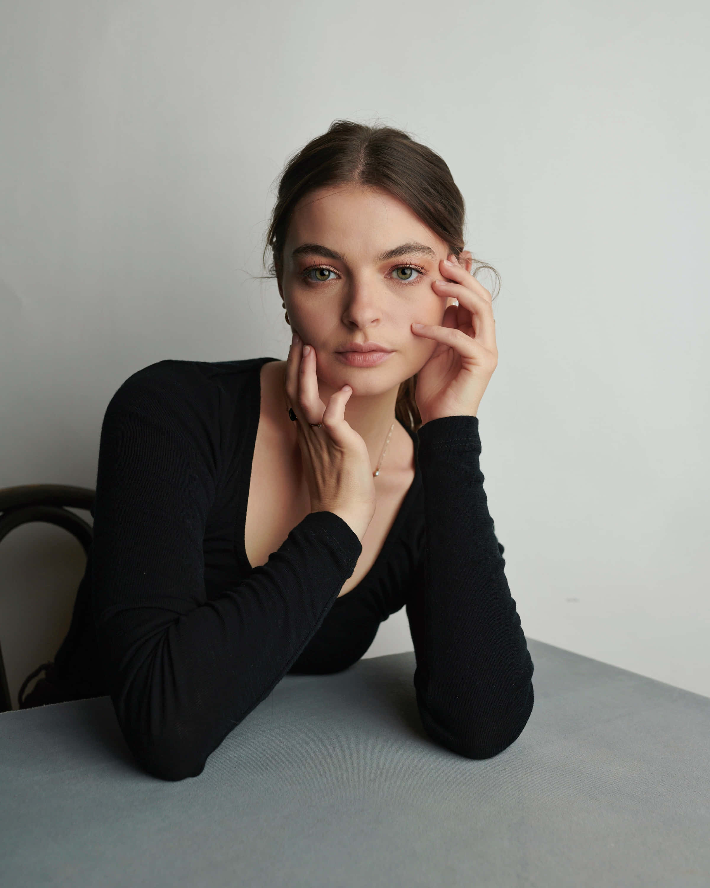 Tiarnie Coupland, black long-sleeve top, plain white wall, 2K Phone Wallpaper