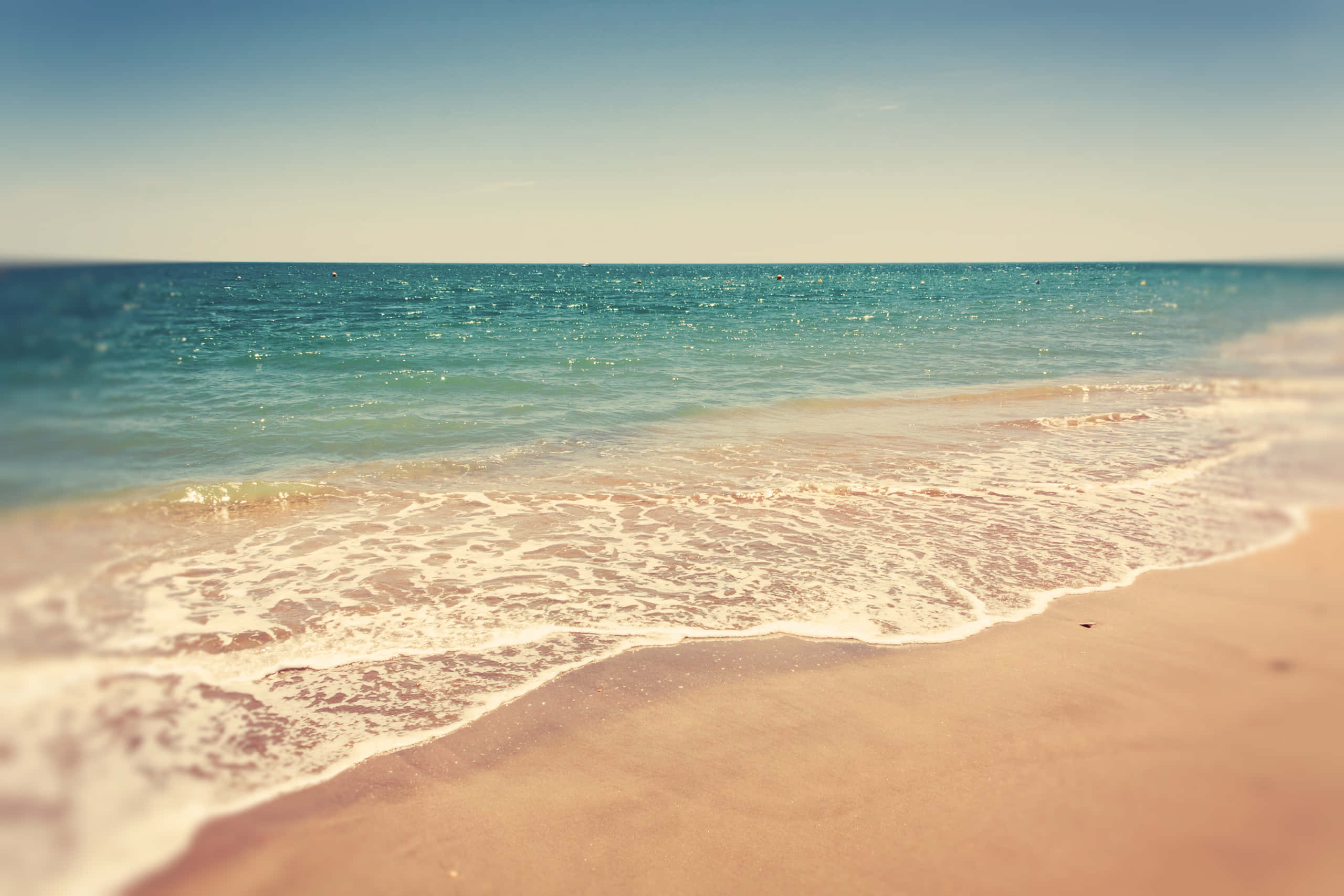 Tides, rocky shoreline, soft turquoise waves, 2K Desktop Wallpaper