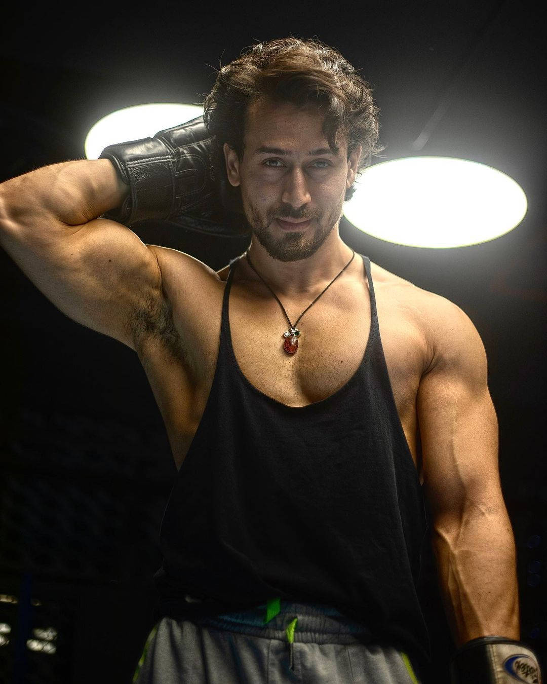 Tiger Shroff, boxing gloves, bright overhead lights, HD Phone Wallpaper