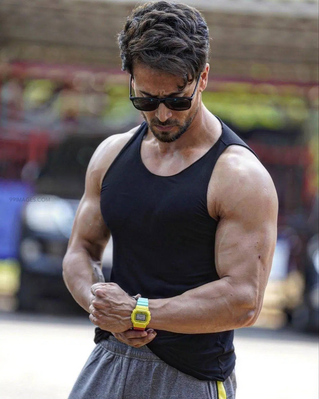 Tiger Shroff, black tank top, colorful watch, HD Phone Wallpaper