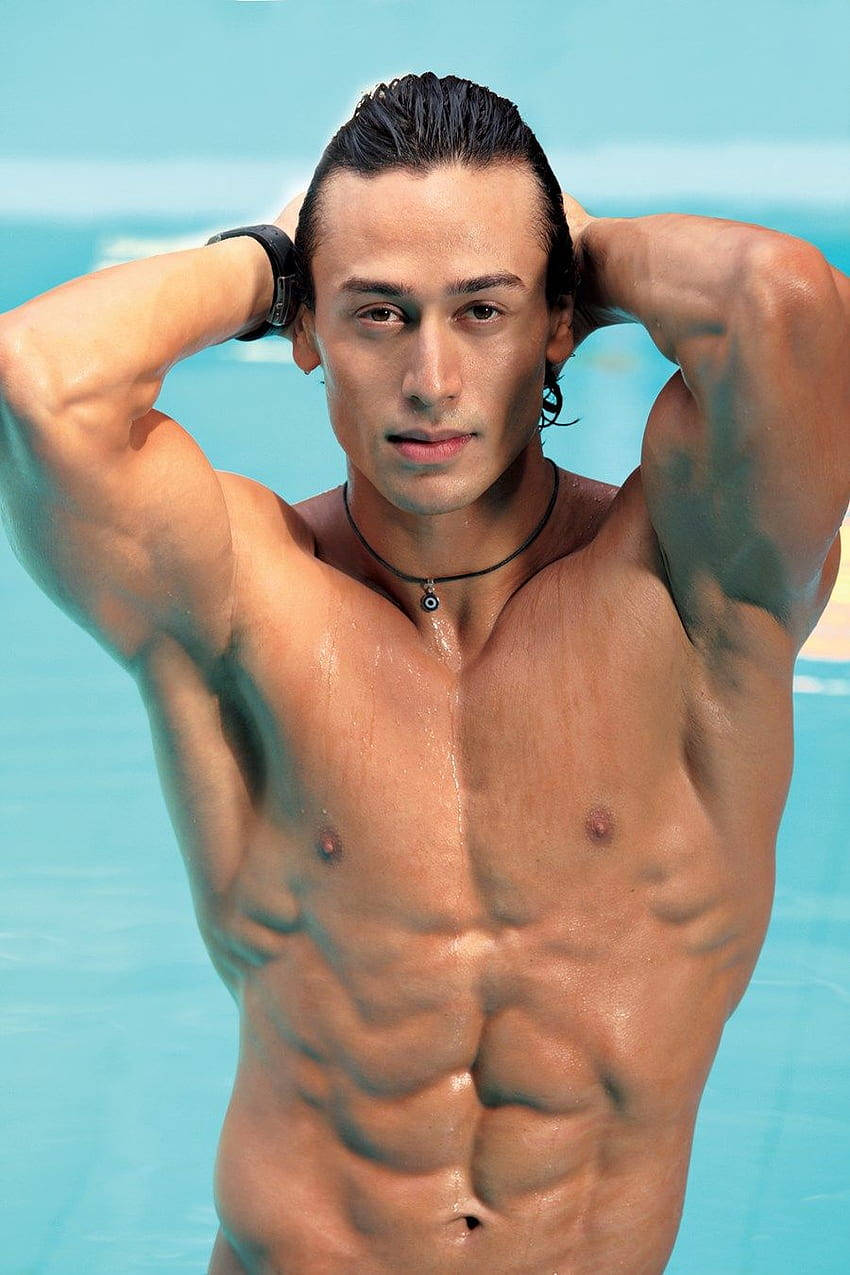 Tiger Shroff, turquoise pool, wet hair, SD Phone Wallpaper