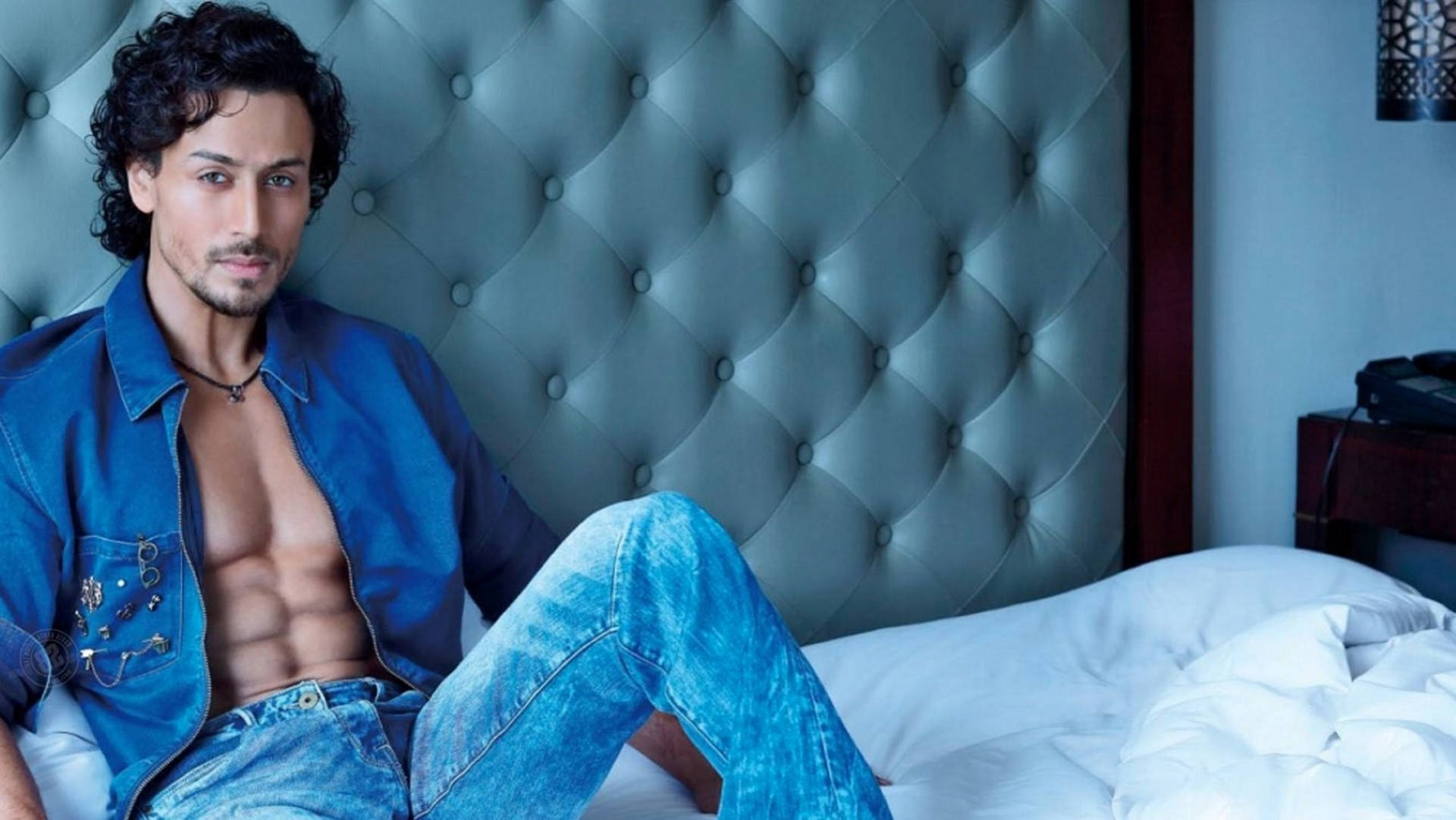 Tiger Shroff, blue denim, bed with tufted headboard, Full HD Desktop Wallpaper